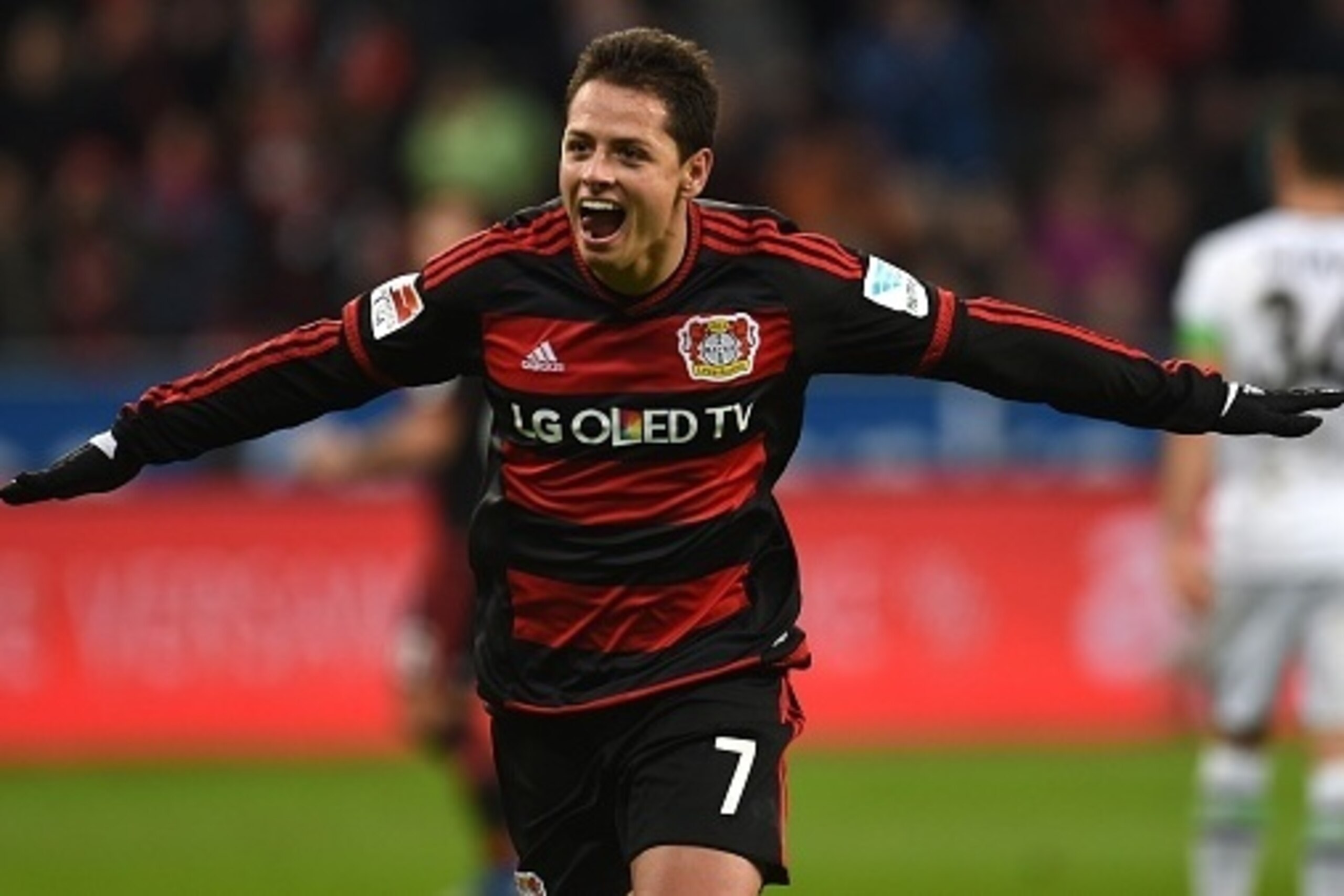 Leverkusen's Mexican striker Javier Hernandez celebrates after scoring during the German first division Bundesliga football match Bayer 04 Leverkusen vs Borussia Moenchengladbach in Leverkusen, western Germany, on December 12, 2015. 
 / AFP / PATRIK STOLL