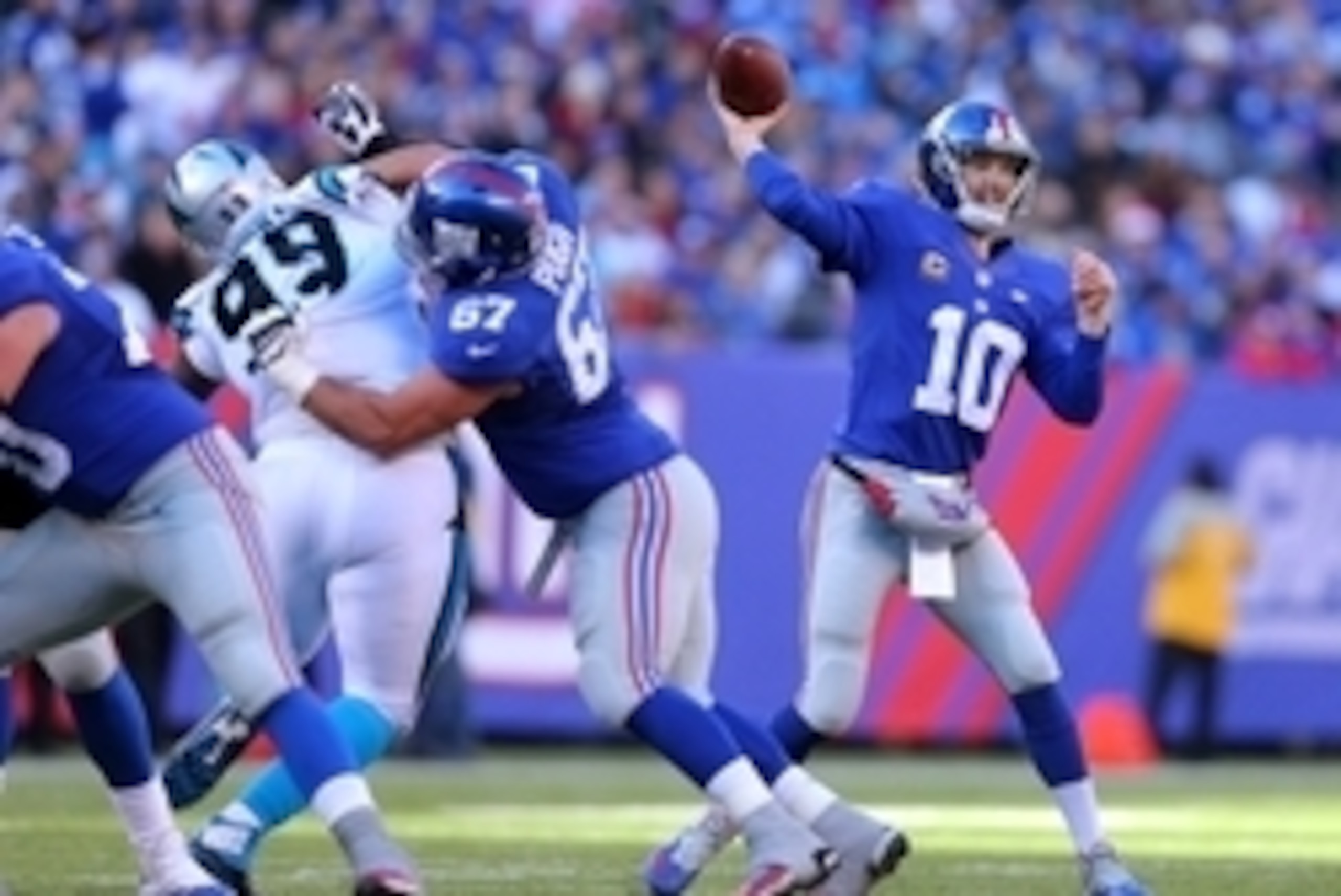 Dec 20, 2015; East Rutherford, NJ, USA; New York Giants quarterback Eli Manning (10) throws a pass against the Carolina Panthers during the first quarter at MetLife Stadium. Mandatory Credit: Brad Penner-USA TODAY Sports