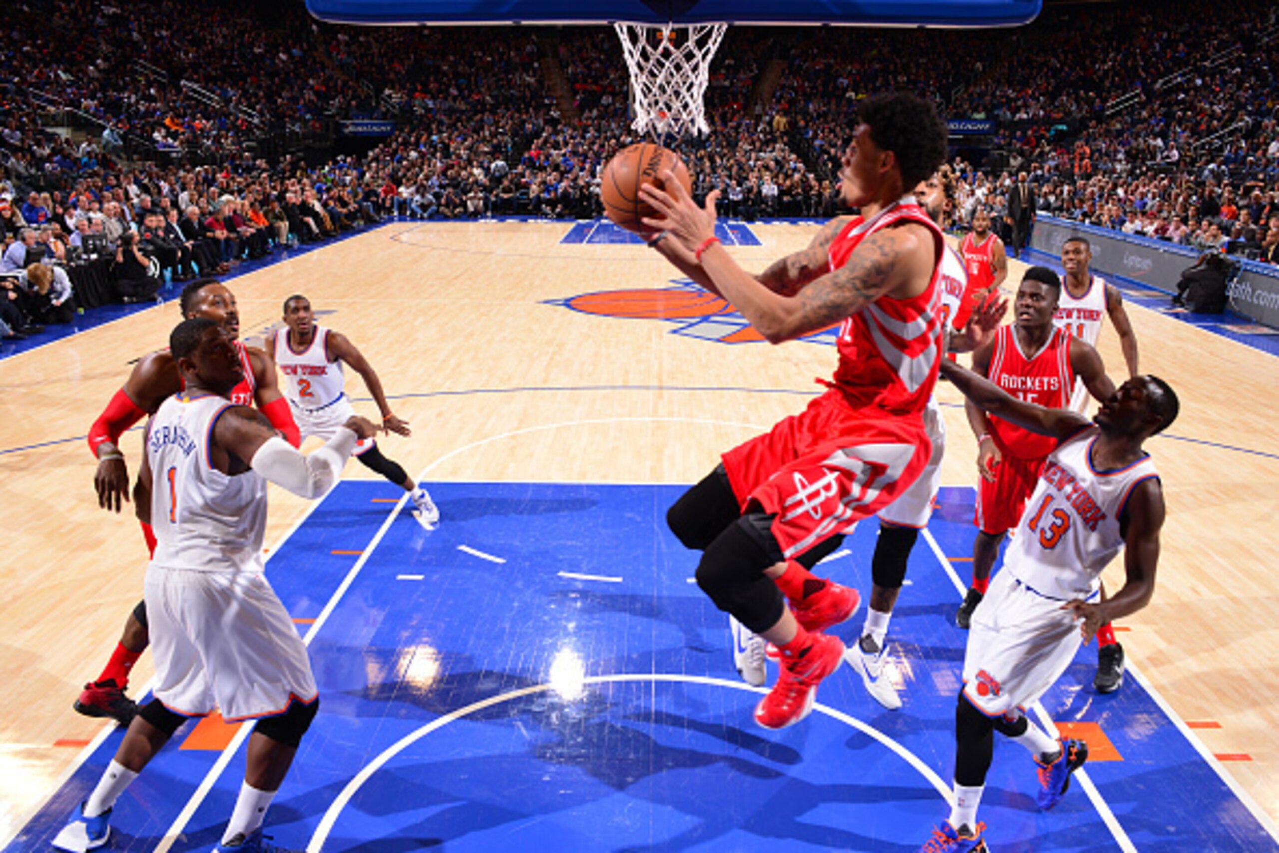 NEW YORK,NY - NOVEMBER 29: K.J. McDaniels #32 of the Houston Rockets goes up for the reverse layup against the New York Knicks at Madison Square Garden on November 29, 2015 in New York,New York NOTE TO USER: User expressly acknowledges and agrees that, by