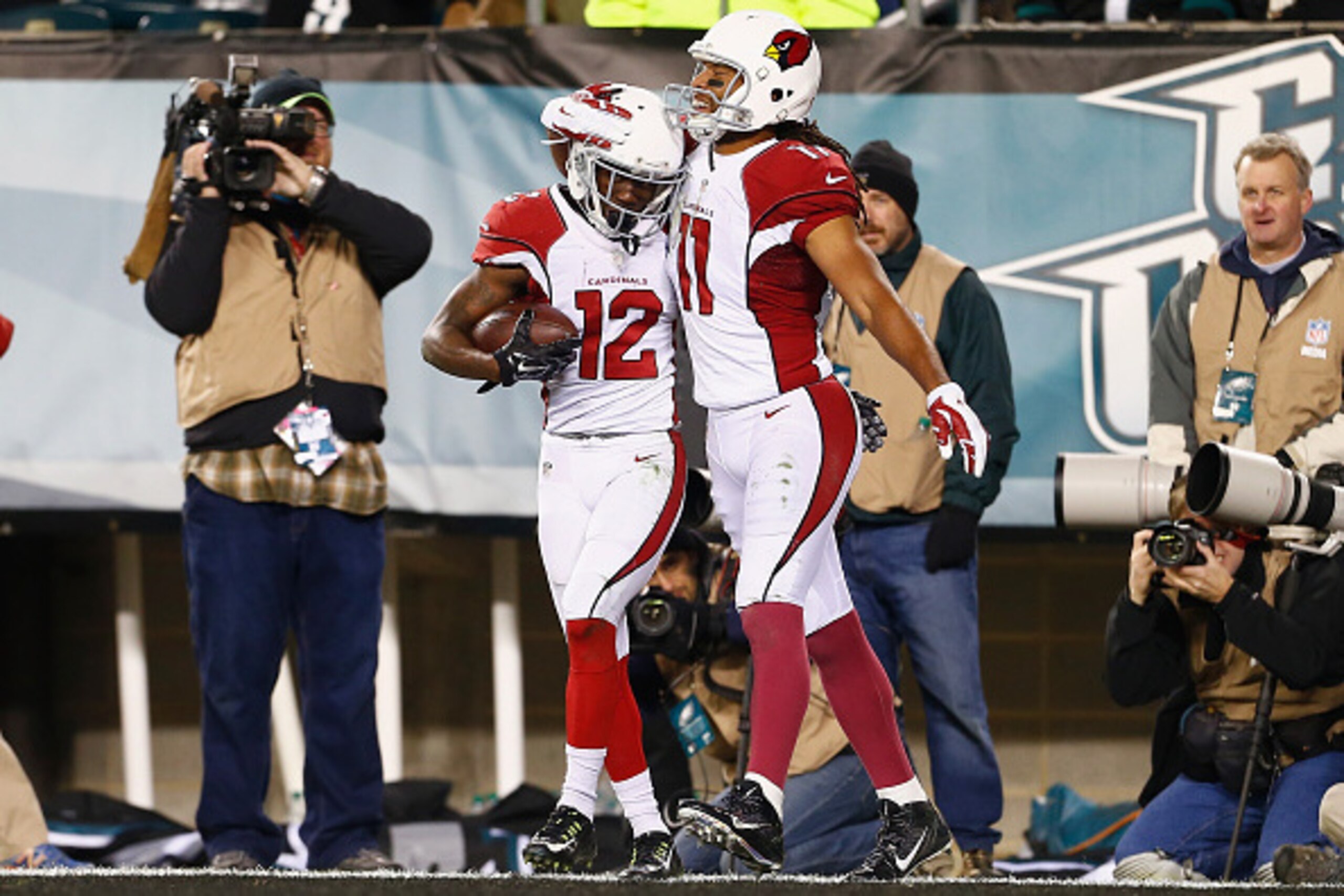 PHILADELPHIA, PA - DECEMBER 20: John Brown #12 of the Arizona Cardinals celebrates his touchdown catch with teammate Larry Fitzgerald #11 in the third quater against the Philadelphia Eagles at Lincoln Financial Field on December 20, 2015 in Philadelphia, PHILADELPHIA, PA - DECEMBER 20: John Brown #12 of the Arizona Cardinals celebrates his touchdown catch with teammate Larry Fitzgerald #11 in the third quater against the Philadelphia Eagles at Lincoln Financial Field on December 20, 2015 in Philadelphia,