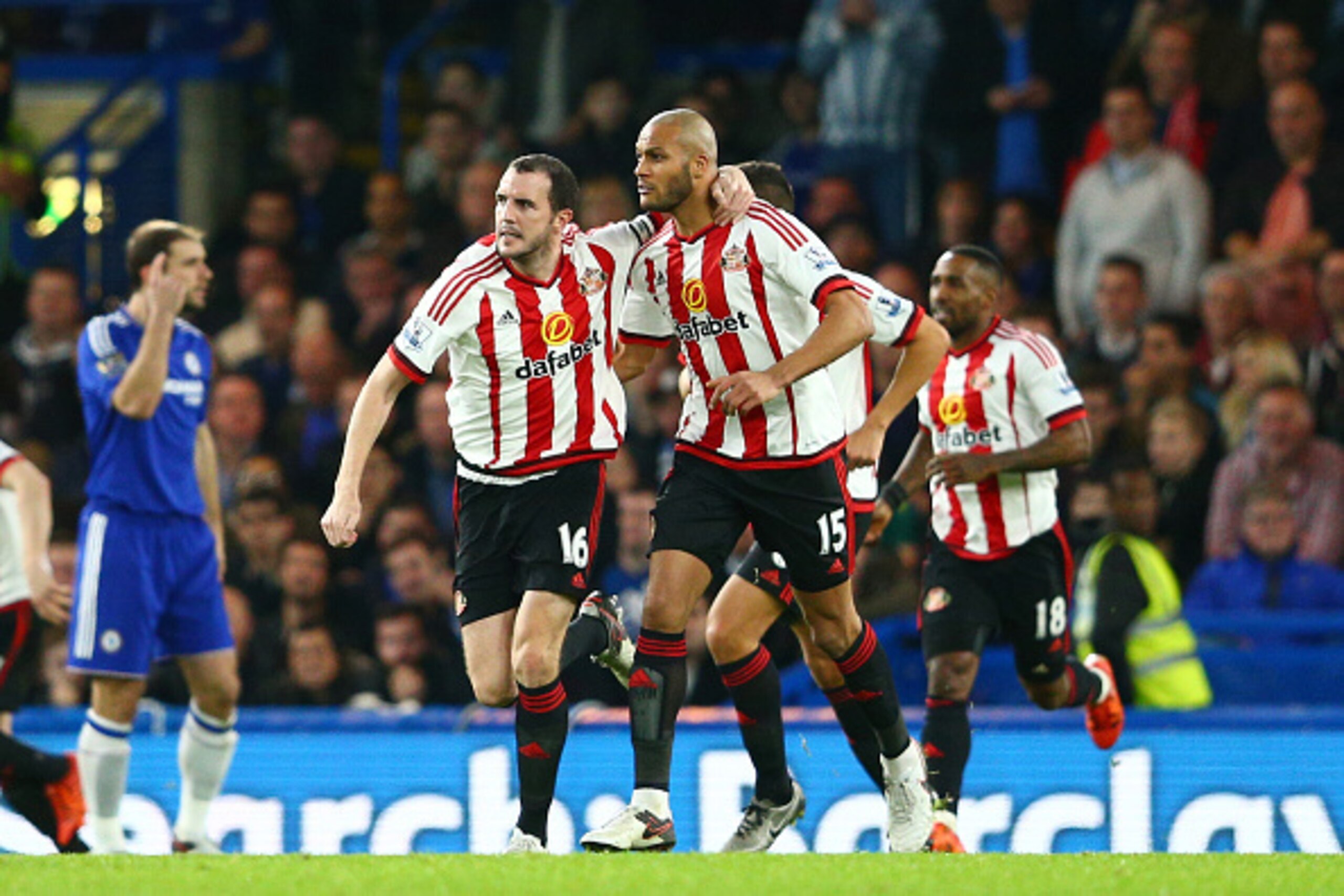 LONDON, ENGLAND - DECEMBER 19: John O'Shea (L) and Younes Kaboul of Sunderland celebrate their team's first goal during the Barclays Premier League match between Chelsea and Sunderland at Stamford Bridge on December 19, 2015 in London, England.  (Photo by