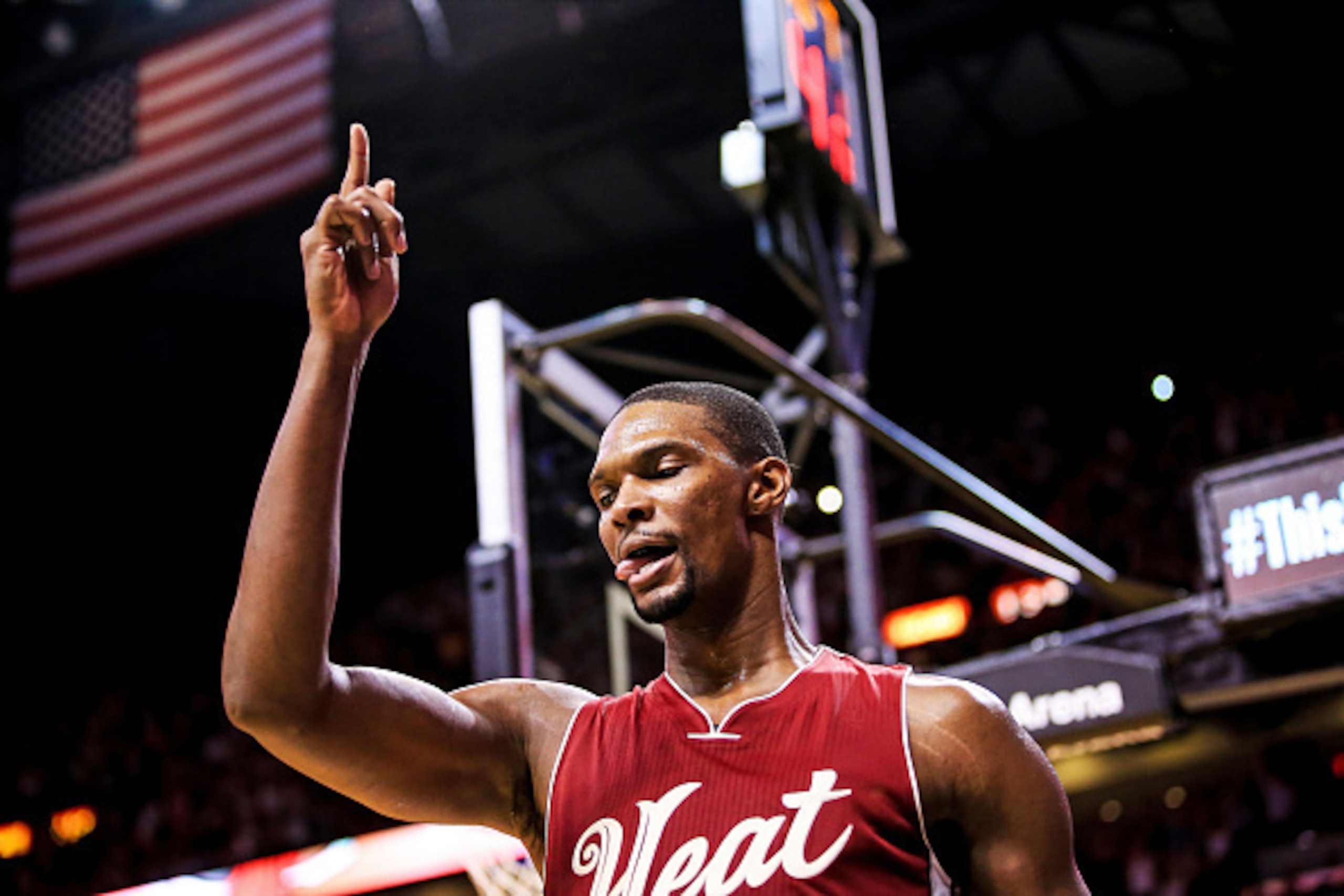 MIAMI, FL - DECEMBER 25: Chris Bosh #1 of the Miami Heat reacts after scoring a basket during overtime of the game against the New Orleans Pelicans at American Airlines Arena on December 25, 2015 in Miami, Florida.  (Photo by Rob Foldy/Getty Images)