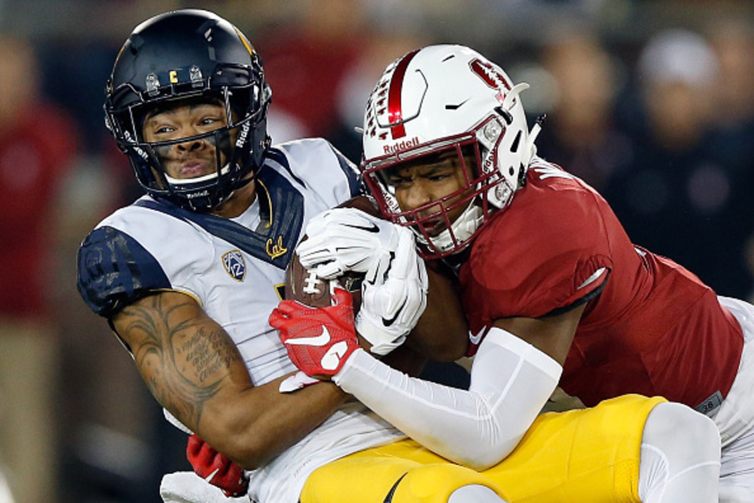 PALO ALTO, CA - NOVEMBER 21:  Bryce Treggs #1 of the California Golden Bears is tackled by Kodi Whitfield #5 of the Stanford Cardinal at Stanford Stadium on November 21, 2015 in Palo Alto, California.  (Photo by Ezra Shaw/Getty Images)