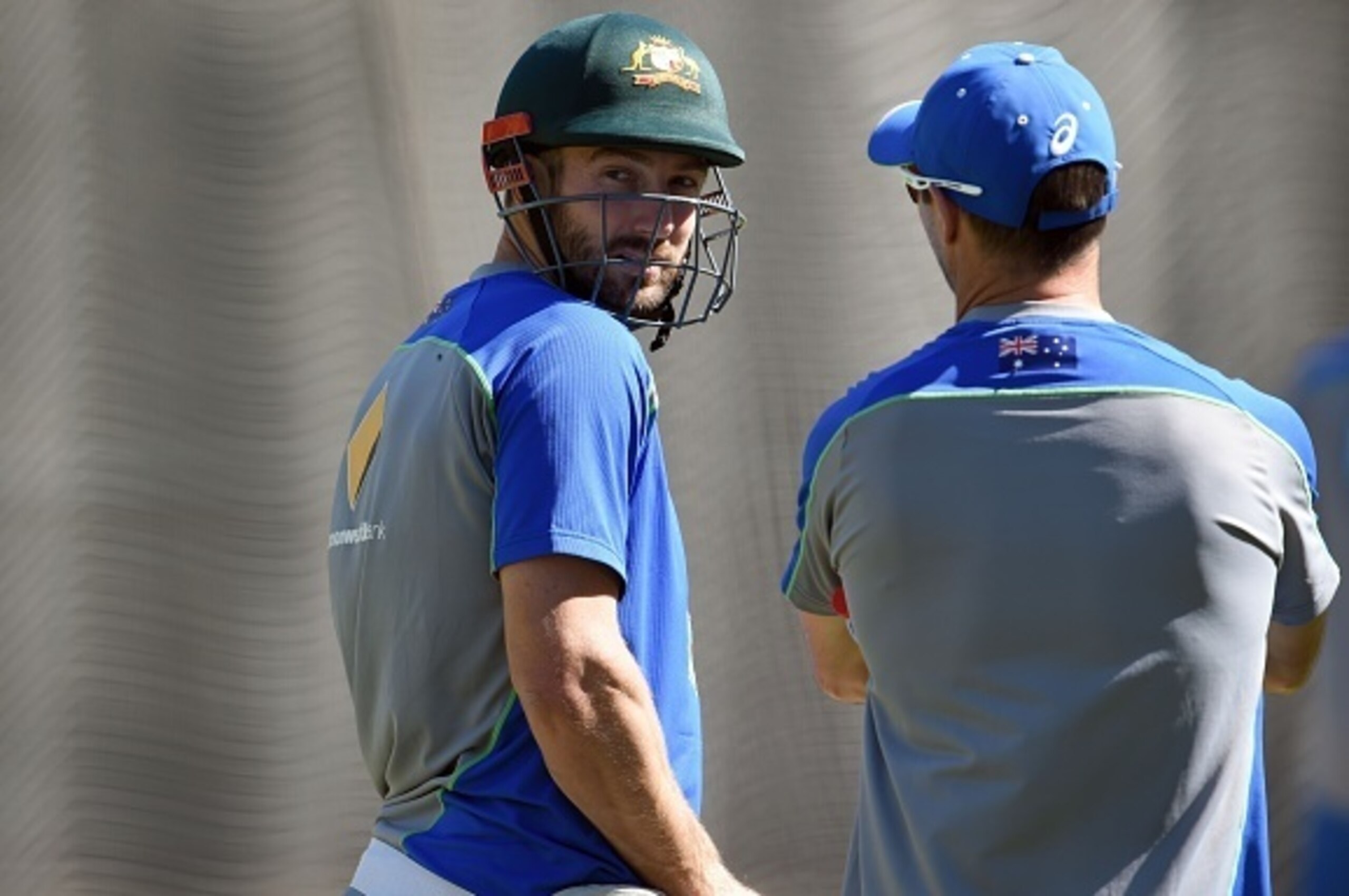 Australian batsman Shaun Marsh (C) looks over his shoulder during a practice session after he was dropped from the team to play the West Indies, in Melbourne on December 25, 2015.  Australia takes on the West Indies in the second cricket Test starting Dec