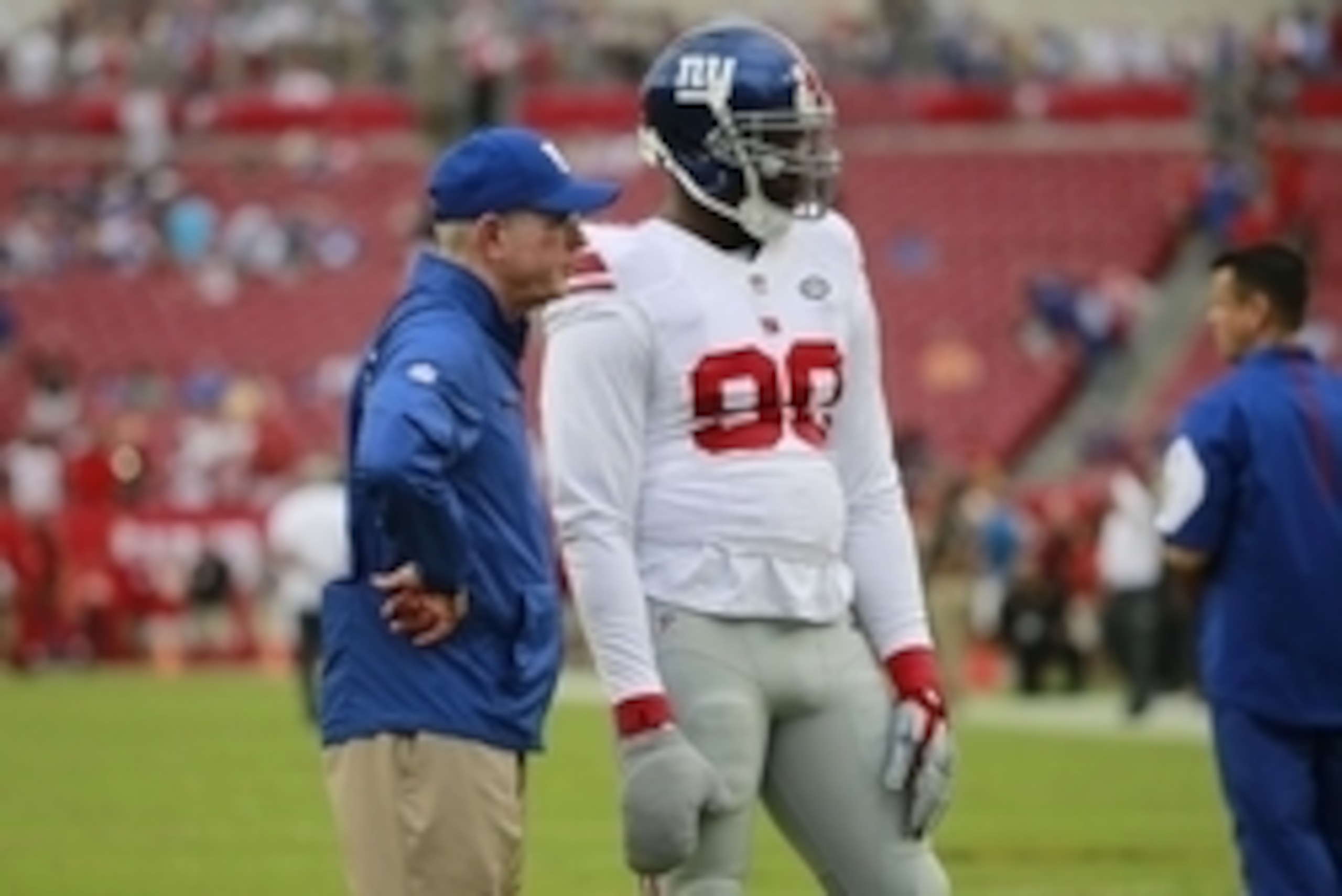 Nov 8, 2015; Tampa, FL, USA; New York Giants defensive end Jason Pierre-Paul (90) talks with head coach Tom Coughlin prior to the game against the Tampa Bay Buccaneers at Raymond James Stadium. Mandatory Credit: Kim Klement-USA TODAY Sports