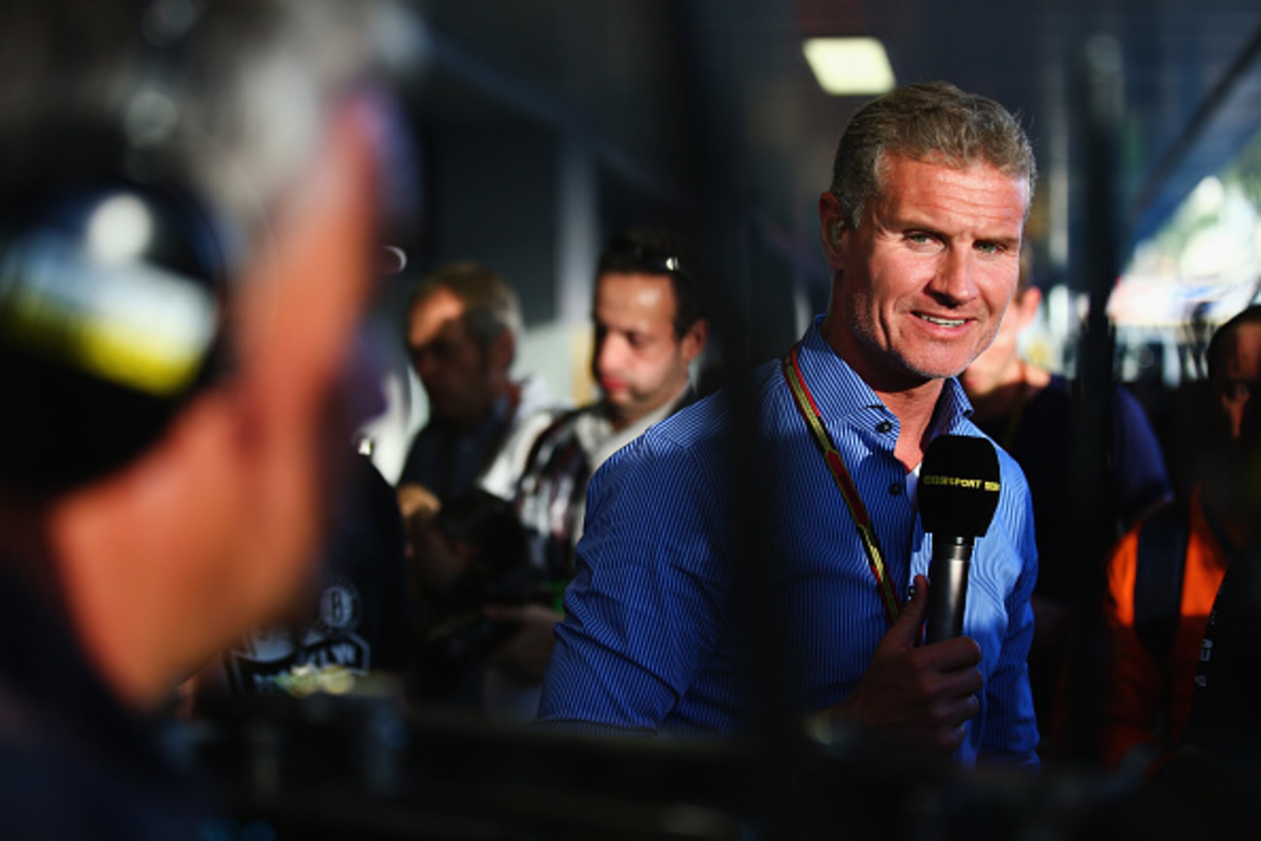 SOCHI, RUSSIA - OCTOBER 12:  David Coulthard speaks to camera during a televsion broadcast at the Russian Formula One Grand Prix at Sochi Autodrom on October 12, 2014 in Sochi, Russia.  (Photo by Paul Gilham/Getty Images)