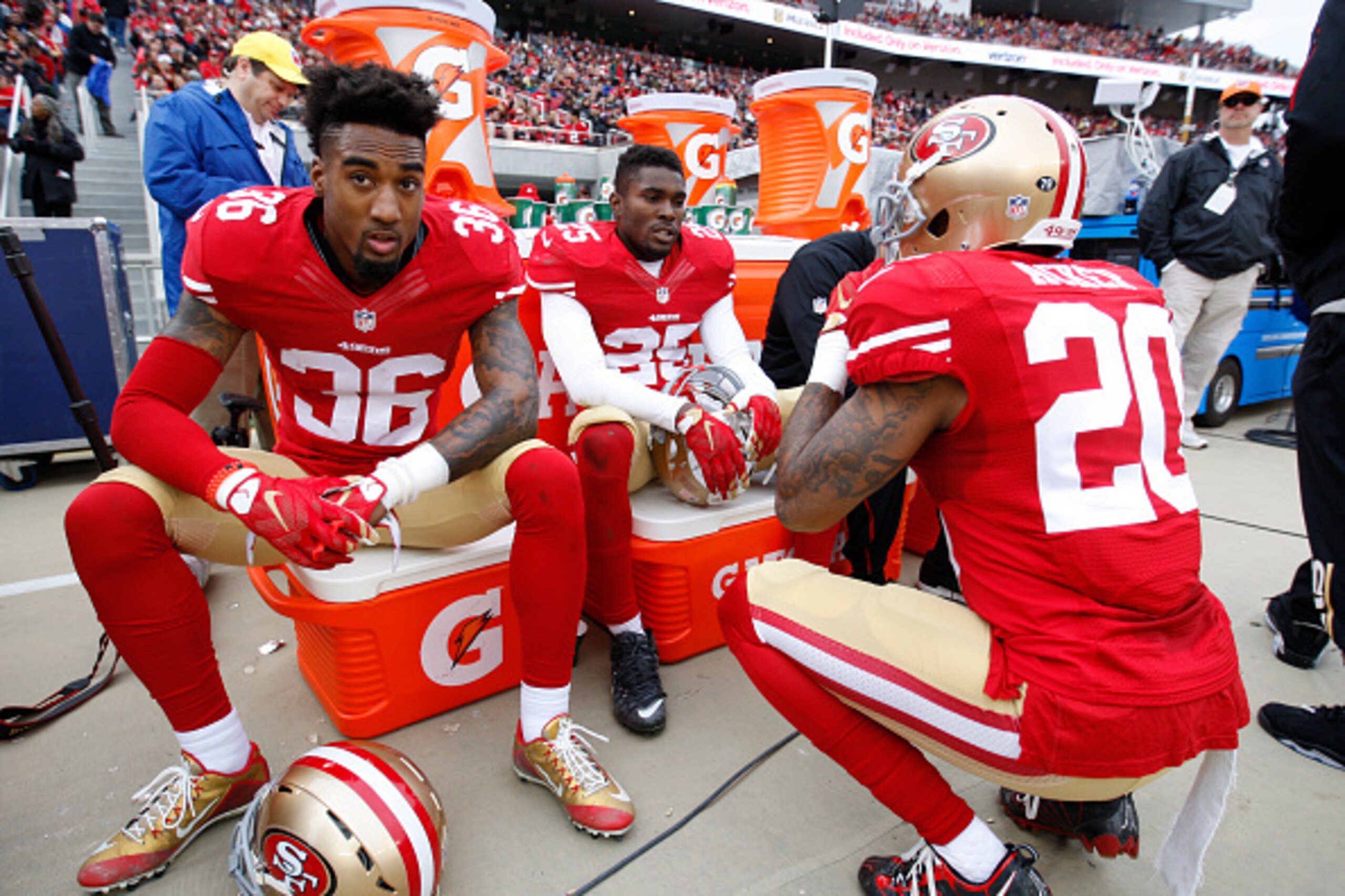 SANTA CLARA, CA - DECEMBER 20: Dontae Johnson #36, Jimmie Ward #25 and Kenneth Acker #20 of the San Francisco 49ers relax on the sideline during the game against the Cincinnati Bengals at Levi Stadium on December 20, 2015 in Santa Clara, California. The B