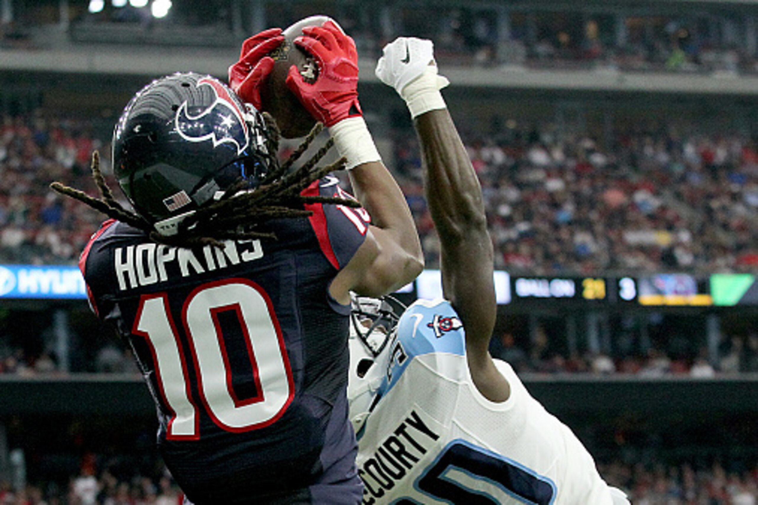 HOUSTON, TX - NOVEMBER 01: DeAndre Hopkins #10 of the Houston Texans catches a touchdown pass while being covered by Jason McCourty #30 of the Tennessee Titans on November 1, 2015 at NRG Stadium in Houston, Texas. Texans won 20 to 6.(Photo by Thomas B. Sh