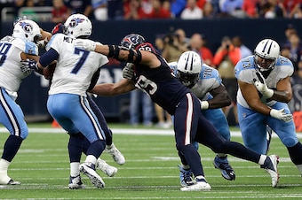 HOUSTON, TX - NOVEMBER 01:  Zach Mettenberger #7 of the Tennessee Titans is pressured by J.J. Watt #99 of the Houston Texans at NRG Stadium on November 1, 2015 in Houston, Texas.  (Photo by Bob Levey/Getty Images)