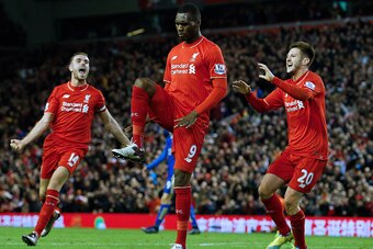 Liverpool's Zaire-born Belgian striker Christian Benteke (C) celebrates with teammates after scoring the opening goal of during the English Premier League football match between Liverpool and Leicester City at the Anfield stadium in Liverpool, north-west 