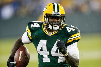 GREEN BAY, WI - DECEMBER 13:  James Starks #44 of the Green Bay Packers runs the football toward the endzone for a touchdown against the Dallas Cowboys in the second quarter at Lambeau Field on December 13, 2015 in Green Bay, Wisconsin.  (Photo by Joe Rob