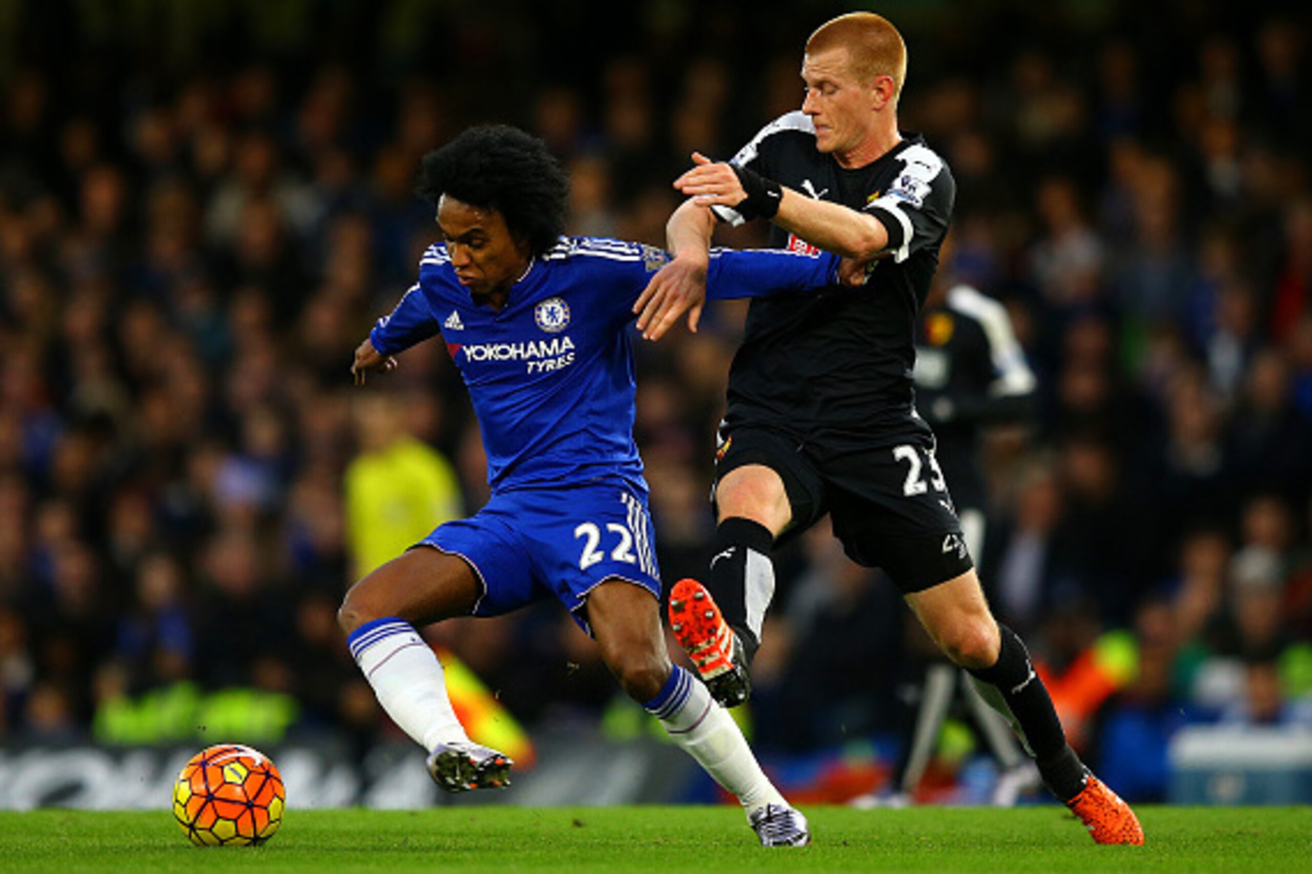 LONDON, ENGLAND - DECEMBER 26:  Willian of Chelsea battles for the ball with Ben Watson of Watford during the Barclays Premier League match between Chelsea and Watford at Stamford Bridge on December 26, 2015 in London, England.  (Photo by Richard Heathcot