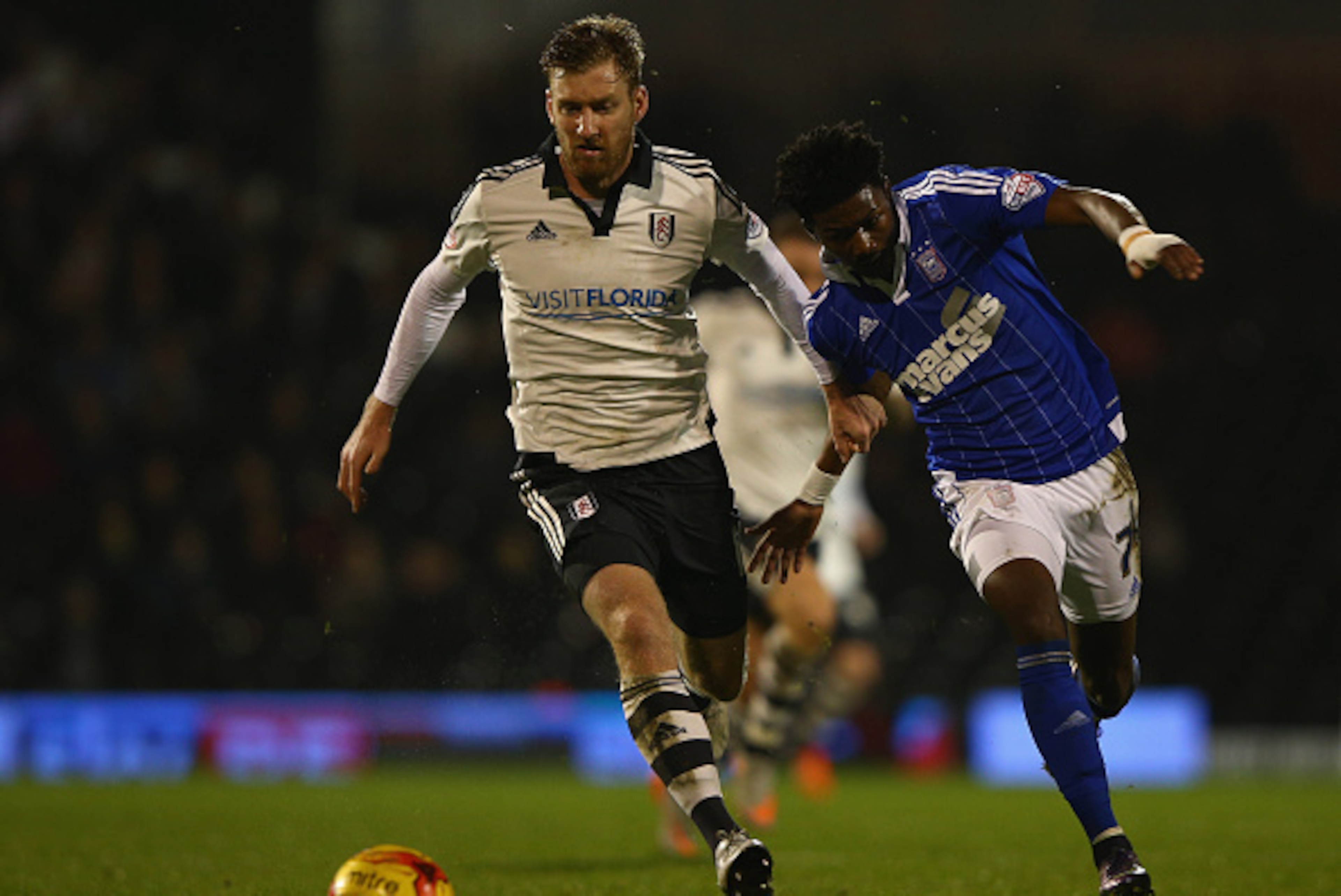 LONDON, ENGLAND - DECEMBER 15: Tim Ream of Fulham tries to tackle Ainsley Maitland-Miles of Ipswich during the Sky Bet Football League Championship match between Fulham and Ipswich Town at Craven Cottage on December 15, 2015 in London, United Kingdom. LONDON, ENGLAND - DECEMBER 15: Tim Ream of Fulham tries to tackle Ainsley Maitland-Miles of Ipswich during the Sky Bet Football League Championship match between Fulham and Ipswich Town at Craven Cottage on December 15, 2015 in London, United Kingdom.