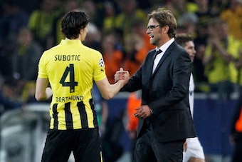 DORTMUND, GERMANY - APRIL 24: Head coach Juergen Klopp (R) of Dortmund shake hands with his team mate Neven Subotic after winning the UEFA Champions League semi final first leg match between Borussia Dortmund and Real Madrid at Signal Iduna Park on April DORTMUND, GERMANY - APRIL 24: Head coach Juergen Klopp (R) of Dortmund shake hands with his team mate Neven Subotic after winning the UEFA Champions League semi final first leg match between Borussia Dortmund and Real Madrid at Signal Iduna Park on April