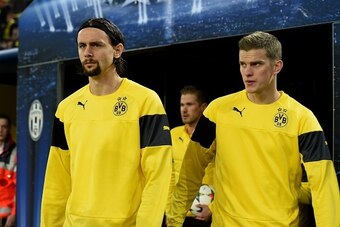 Dortmund's Serbian defender Neven Subotic and Dortmund's midfielder Sven Bender make their way on to the pitch prior to the Round of 16, second-leg UEFA Champions League football match Borussia Dortmund vs Juventus in Dortmund, western Germany on March 18 Dortmund's Serbian defender Neven Subotic and Dortmund's midfielder Sven Bender make their way on to the pitch prior to the Round of 16, second-leg UEFA Champions League football match Borussia Dortmund vs Juventus in Dortmund, western Germany on March 18