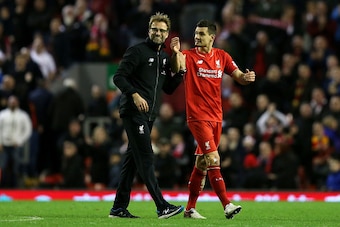 LIVERPOOL, ENGLAND - DECEMBER 26:  Jurgen Klopp, Manager of Liverpool celebrates with Dejan Lovren of Liverpool following the Barclays Premier League match between Liverpool and Leicester City at Anfield on December 26, 2015 in Liverpool, England.  (Photo