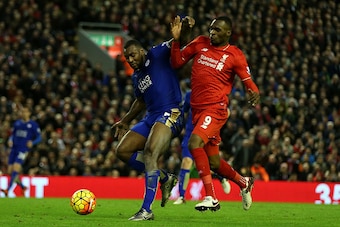 LIVERPOOL, ENGLAND - DECEMBER 26:  Wes Morgan of Leicester City (L) battles for the ball with Christian Benteke of Liverpool during the Barclays Premier League match between Liverpool and Leicester City at Anfield on December 26, 2015 in Liverpool, Englan