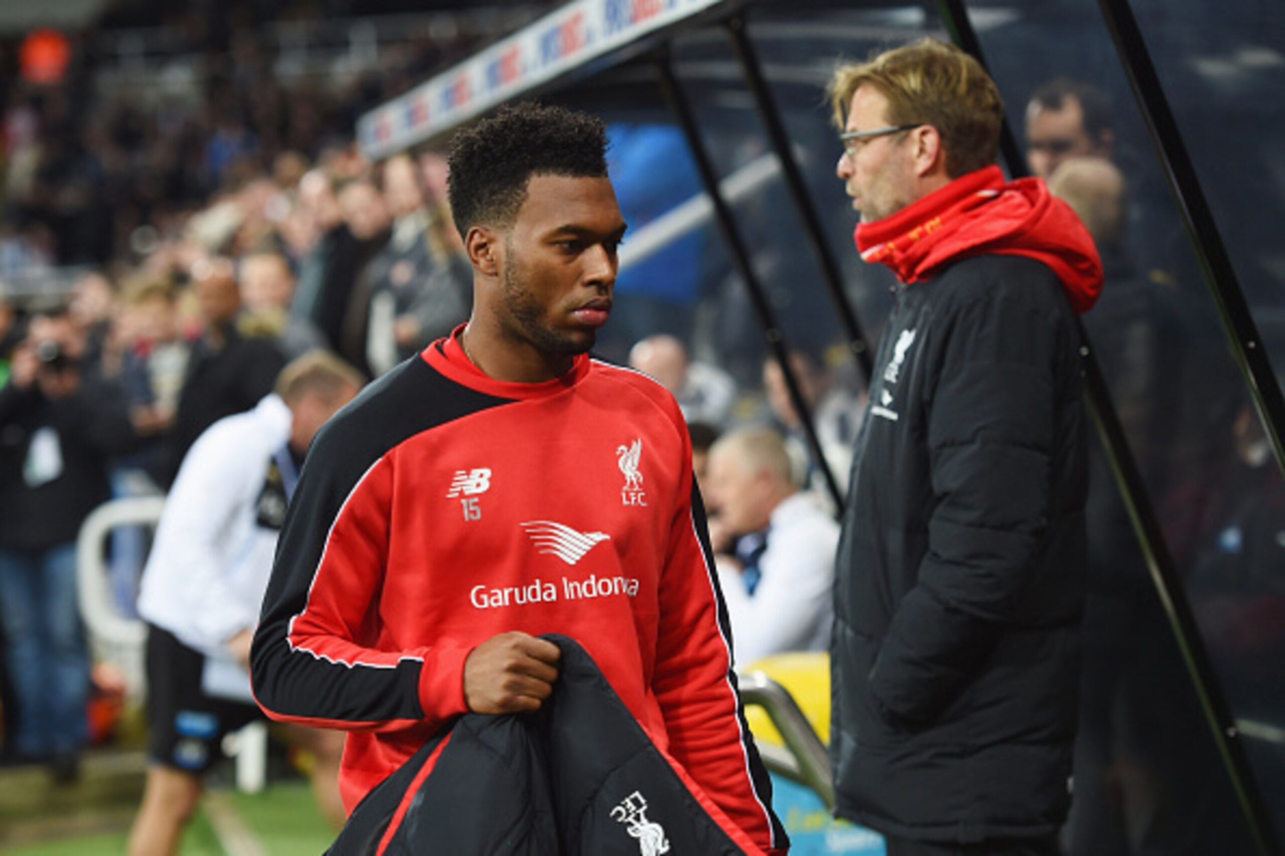 NEWCASTLE UPON TYNE, ENGLAND - DECEMBER 06:  Substitute Daniel Sturridge of Liverpool walks to the bench past Jurgen Klopp manager of Liverpool prior to the Barclays Premier League match between Newcastle United and Liverpool at St James' Park on December