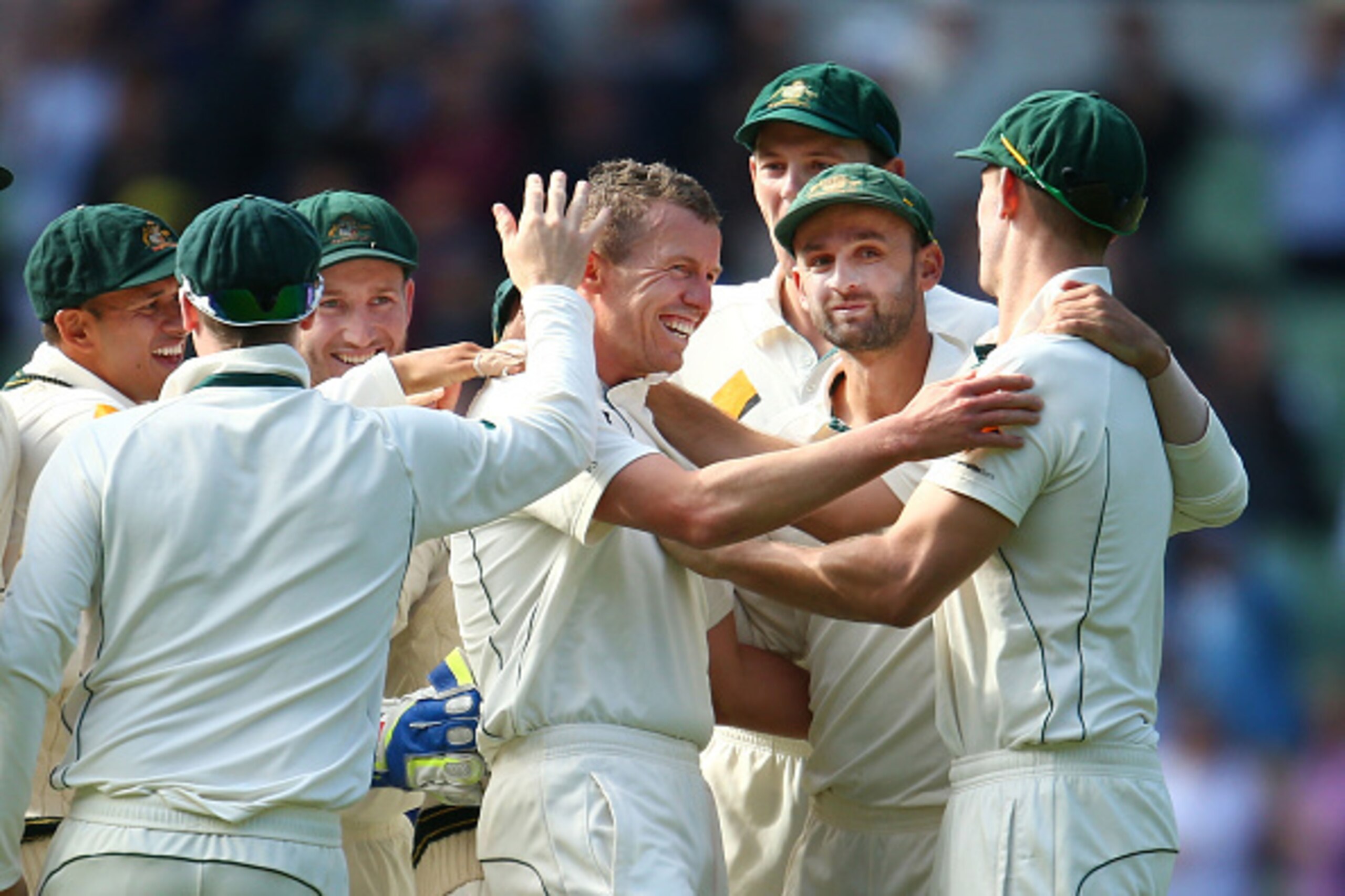 MELBOURNE, AUSTRALIA - DECEMBER 27:  Peter Siddle of Australia is congratulated by his teammates after dismissing Jason Holder of the West Indies during day two of the Second Test match between Australia and the West Indies at the Melbourne Cricket Ground
