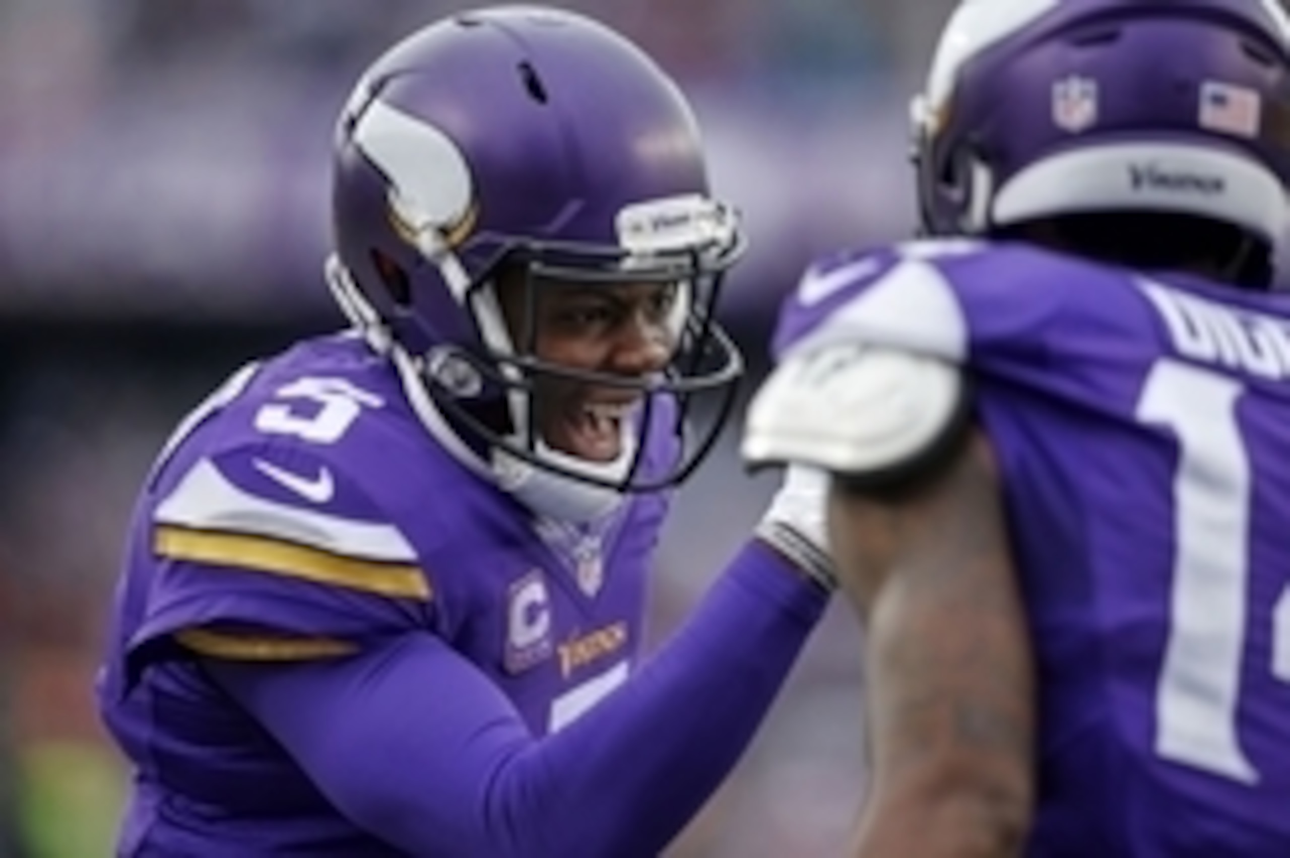 Dec 20, 2015; Minneapolis, MN, USA; Minnesota Vikings quarterback Teddy Bridgewater (5) celebrates his touchdown pass with wide receiver Stefon Diggs (14) against the Chicago Bears in the third quarter at TCF Bank Stadium. The Vikings win 38-17. Mandatory