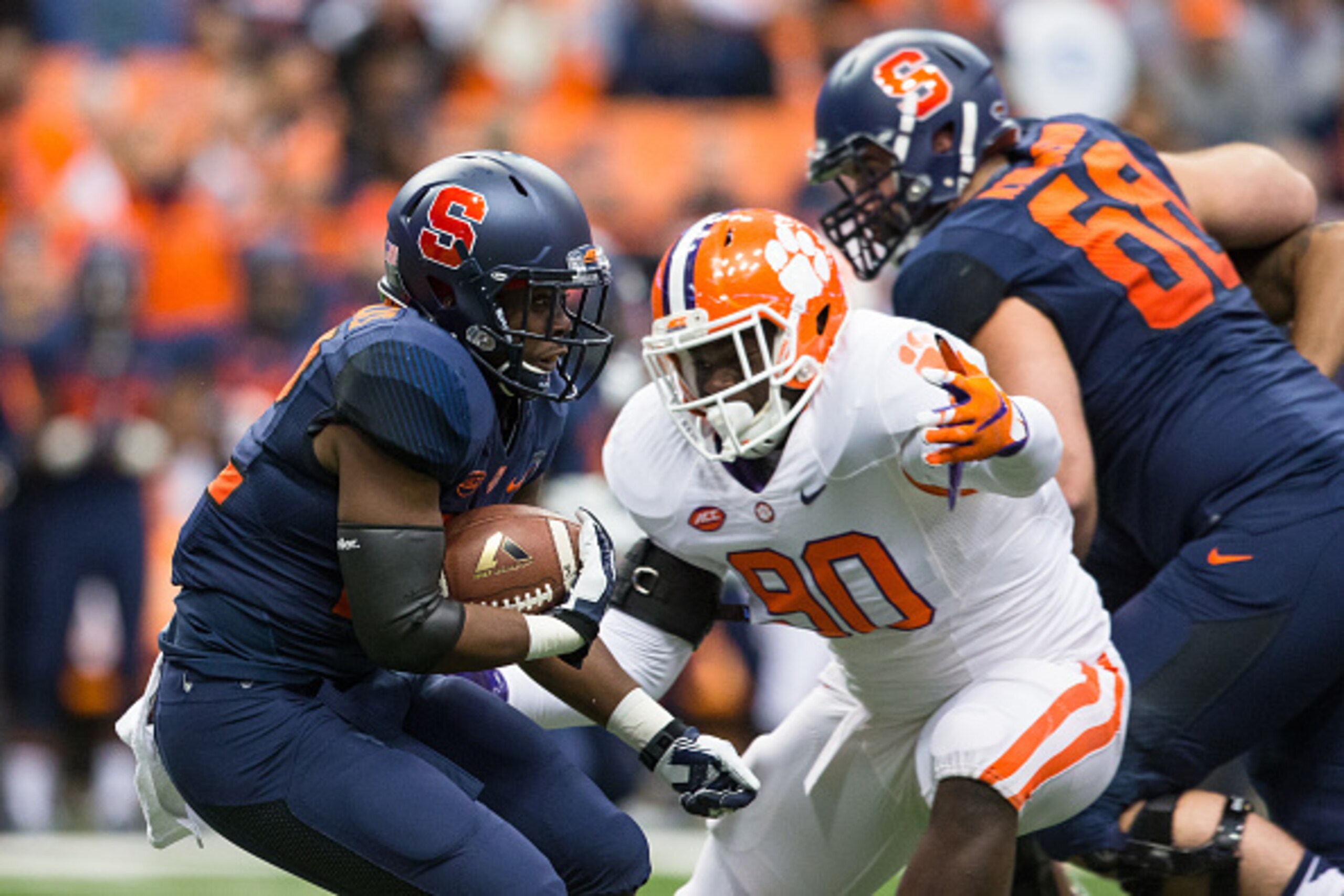 SYRACUSE, NY - NOVEMBER 14:  Shaq Lawson #90 of the Clemson Tigers tackles Jordan Fredericks #22 of the Syracuse Orange during the first half on November 14, 2015 at The Carrier Dome in Syracuse, New York.  Clemson defeats Syracuse 37-27.  (Photo by Brett