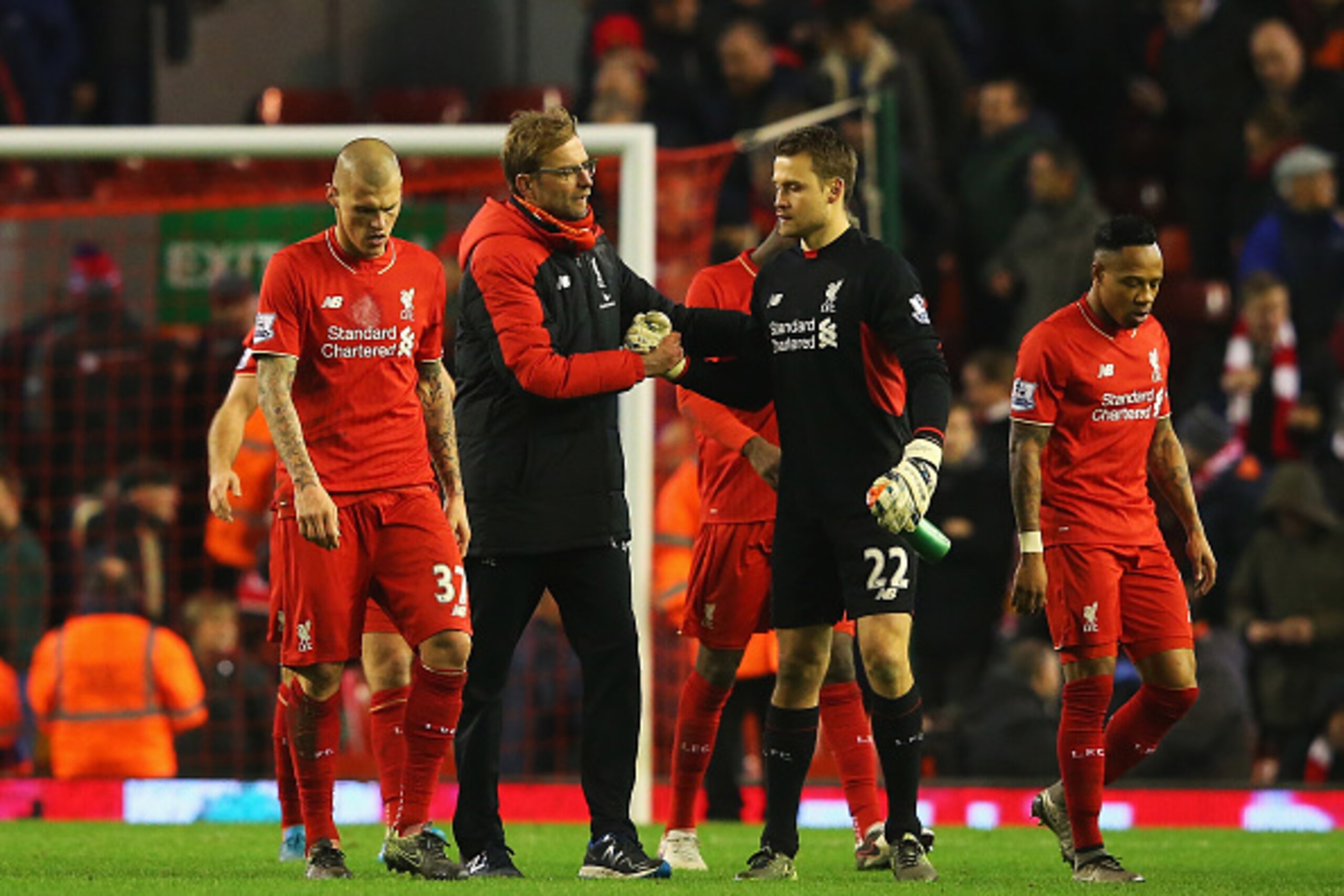 LIVERPOOL, ENGLAND - DECEMBER 13:  Jurgen Klopp, manager of Liverpool shakes hands with Simon Mignolet of Liverpool after the Barclays Premier League match between Liverpool and West Bromwich Albion at Anfield on December 13, 2015 in Liverpool, England.  