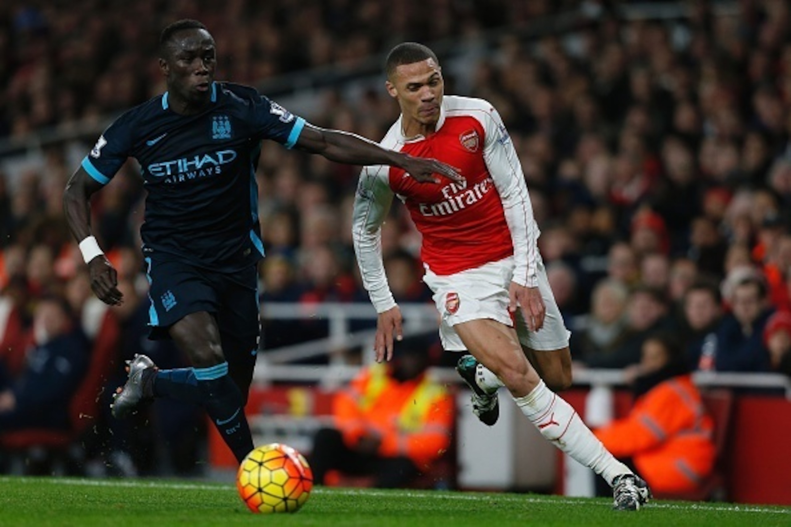 Manchester City's French defender Bacary Sagna (L) vies with Arsenal's English defender Kieran Gibbs during the English Premier League football match between Arsenal and Manchester City at the Emirates Stadium in London on December 21, 2015. AFP PHOTO / I