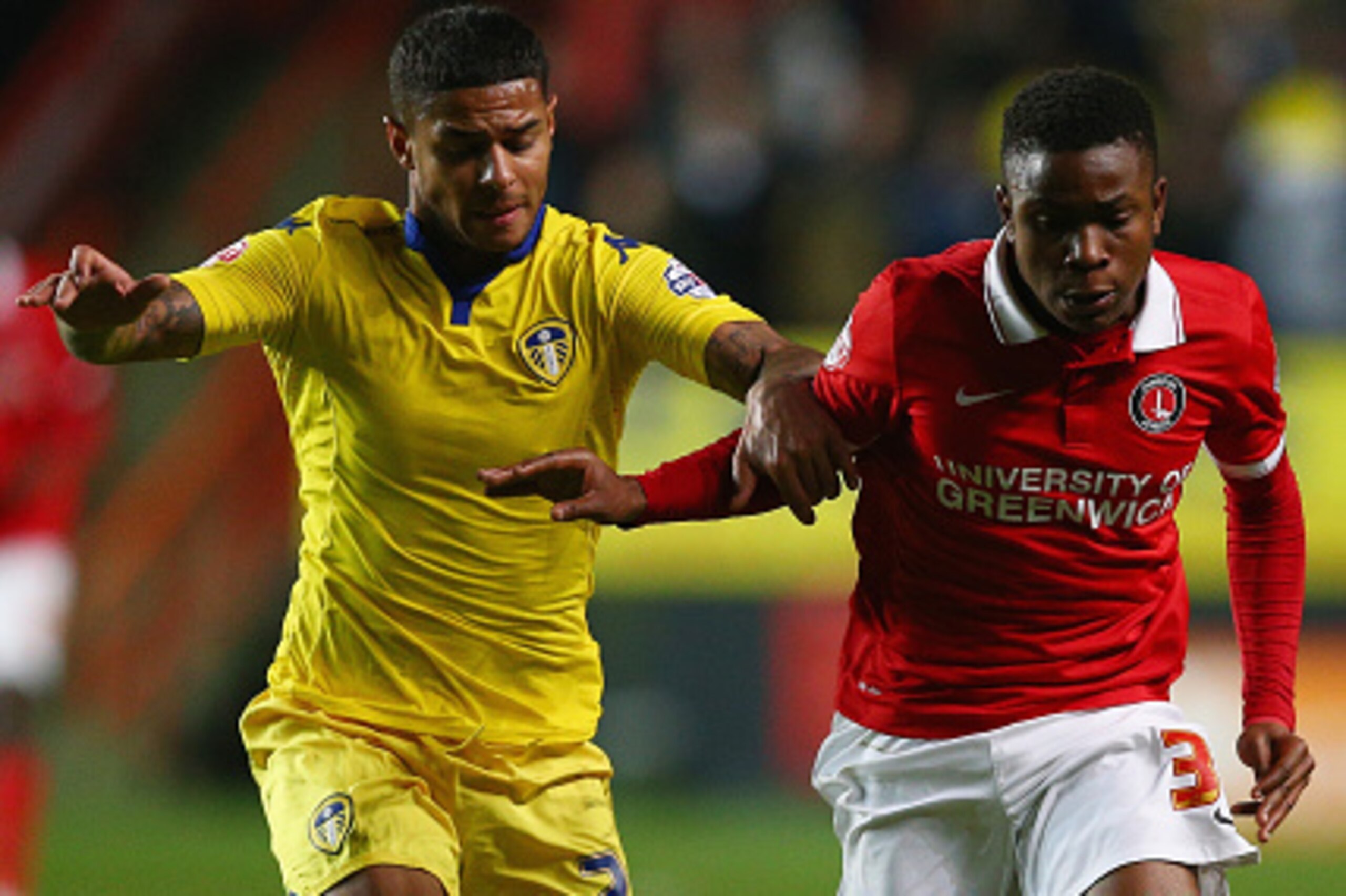 LONDON, ENGLAND - DECEMBER 12:  Ademola Lookman (R) and Liam Bridcutt of Leeds compete for the ball during the Sky Bet Championship match between Charlton Athletic and Leeds United at The Valley on December 12, 2015 in London, United Kingdom.  (Photo by H