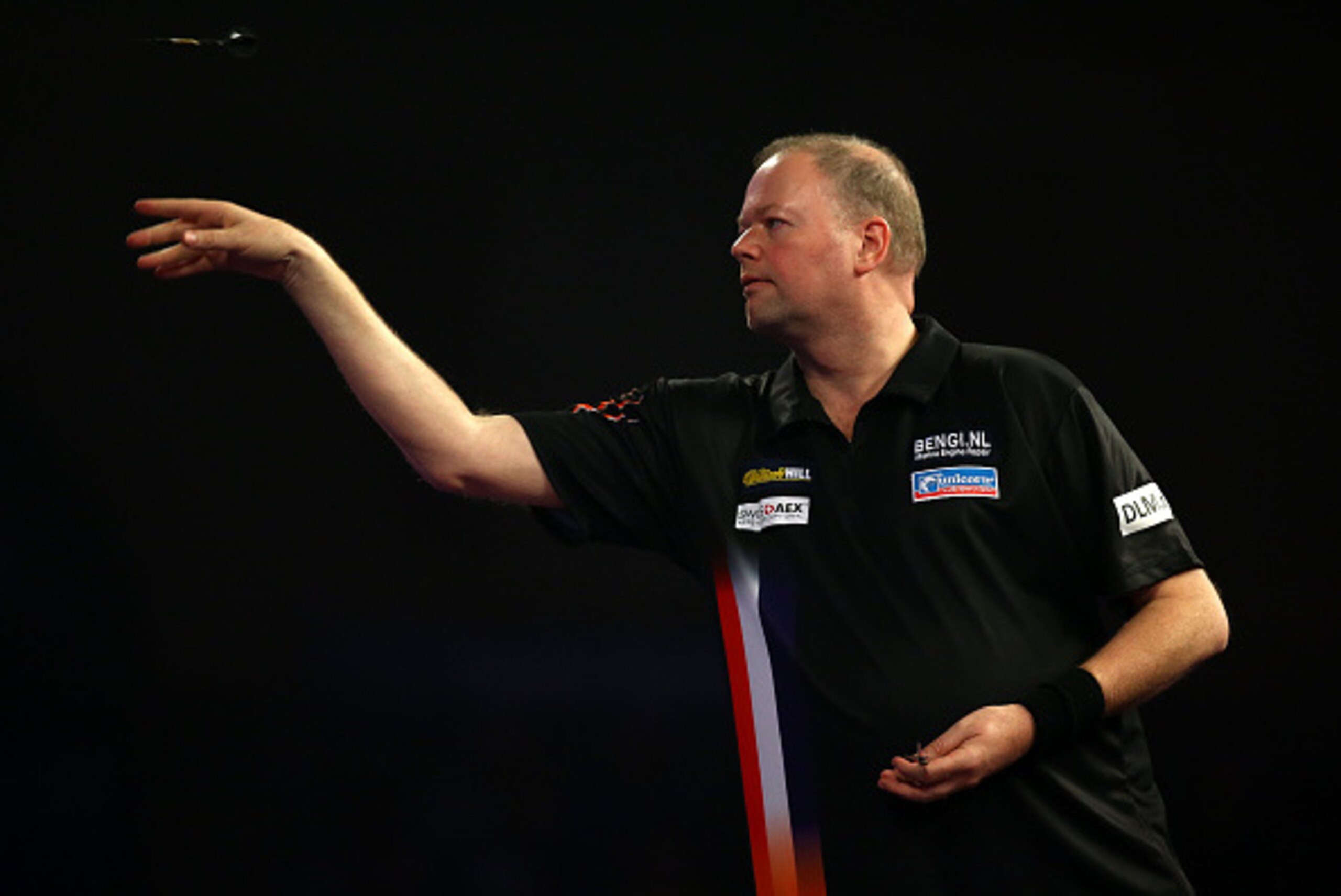 LONDON, ENGLAND - DECEMBER 20: Raymond van Barneveld of Holland in action during his first round match against Dirk van Duijvenbode during the 2016 William Hill PDC World Darts Championships on Day Four at Alexandra Palace on December 20, 2015 in London, 