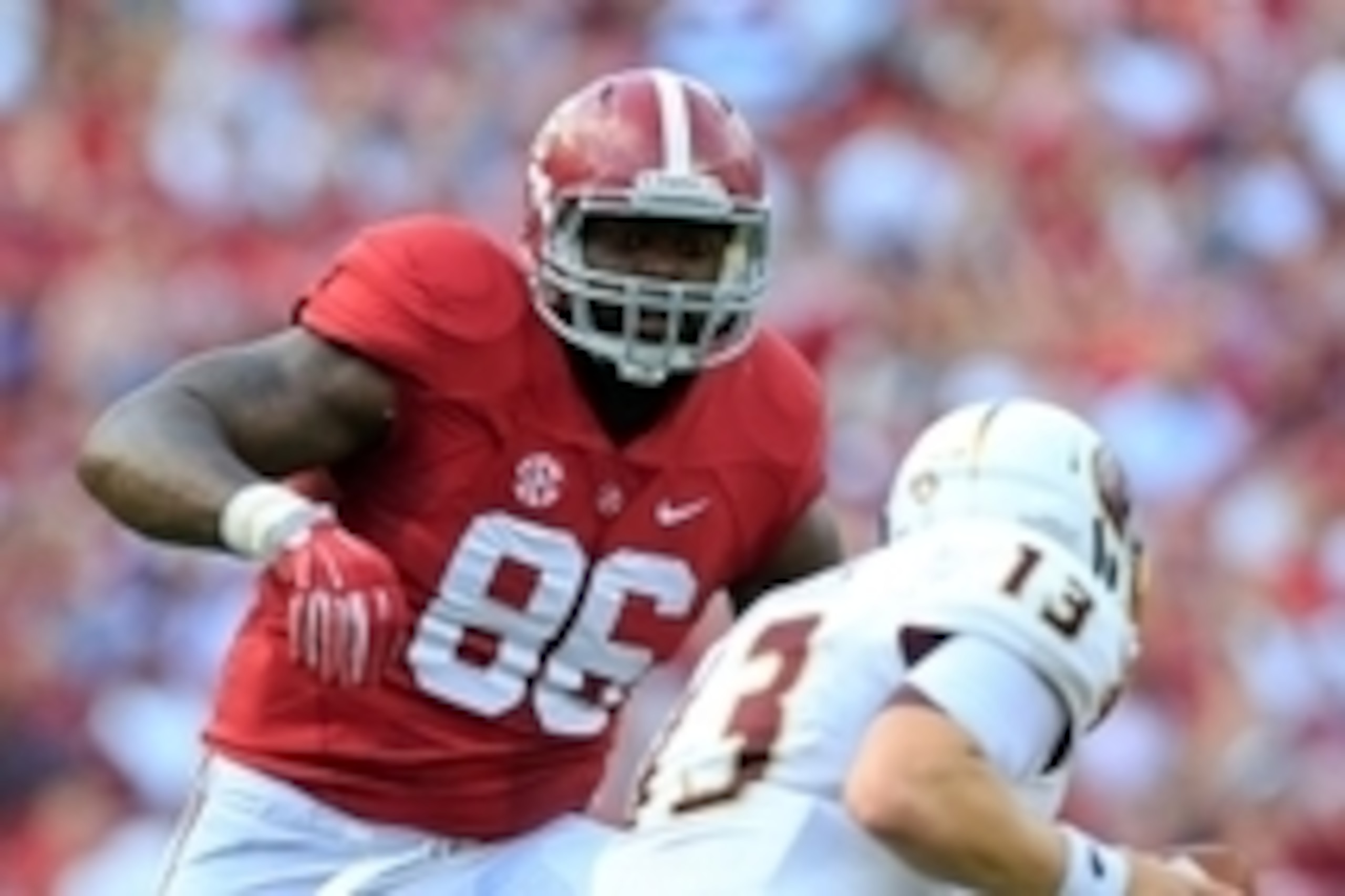 Sep 26, 2015; Tuscaloosa, AL, USA; Alabama Crimson Tide defensive lineman A'Shawn Robinson (86) chases after Louisiana Monroe Warhawks quarterback Garrett Smith (13) at Bryant-Denny Stadium. Mandatory Credit: Marvin Gentry-USA TODAY Sports