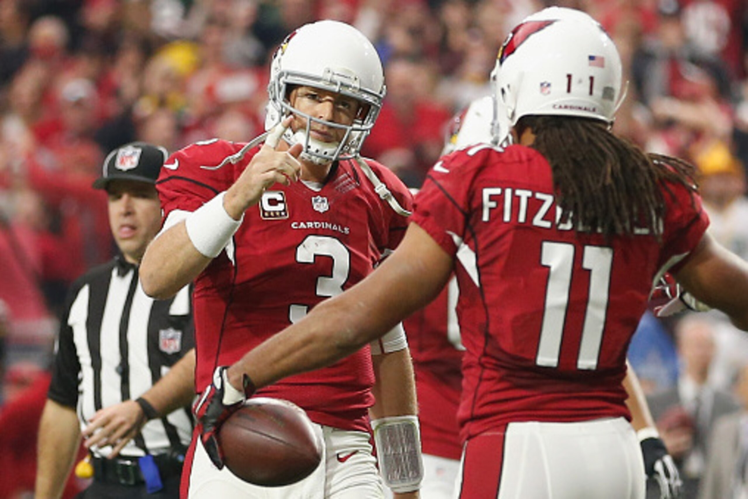 GLENDALE, AZ - DECEMBER 27: Wide receiver Larry Fitzgerald #11 and quarterback Carson Palmer #3 of the Arizona Cardinals celebrate after Fitzgerald scored a 3 yard touchdown in the second quarter of the NFL game against the Green Bay Packers at the Univer GLENDALE, AZ - DECEMBER 27: Wide receiver Larry Fitzgerald #11 and quarterback Carson Palmer #3 of the Arizona Cardinals celebrate after Fitzgerald scored a 3 yard touchdown in the second quarter of the NFL game against the Green Bay Packers at the Univer