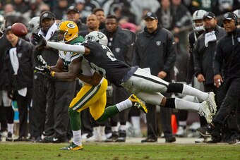 OAKLAND, CA - DECEMBER 20:  Cornerback David Amerson #29 of the Oakland Raiders knocks away a pass from wide receiver James Jones #89 of the Green Bay Packers in the first half on December 20, 2015 at O.co Coliseum in Oakland, California.  The Packers won