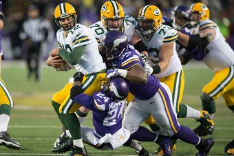 MINNEAPOLIS, MN - NOVEMBER 22: Captain Munnerlyn #24 and Tom Johnson #92 of the Minnesota Vikings sacks Aaron Rodgers #12 of the Green Bay Packers during an NFL game against the Green Bay Packers at TCF Bank Stadium November 8, 2015 in Minneapolis, Minnes