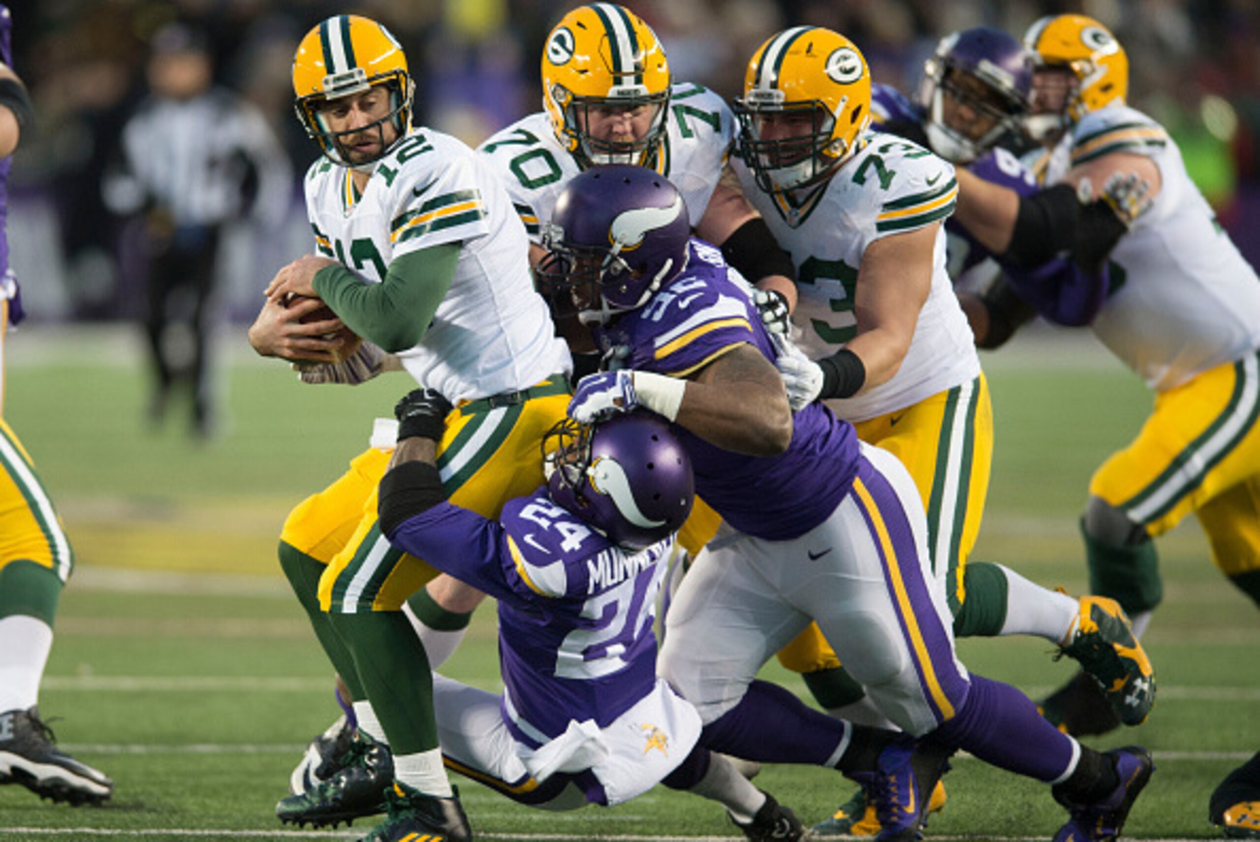 MINNEAPOLIS, MN - NOVEMBER 22: Captain Munnerlyn #24 and Tom Johnson #92 of the Minnesota Vikings sacks Aaron Rodgers #12 of the Green Bay Packers during an NFL game against the Green Bay Packers at TCF Bank Stadium November 8, 2015 in Minneapolis, Minnes