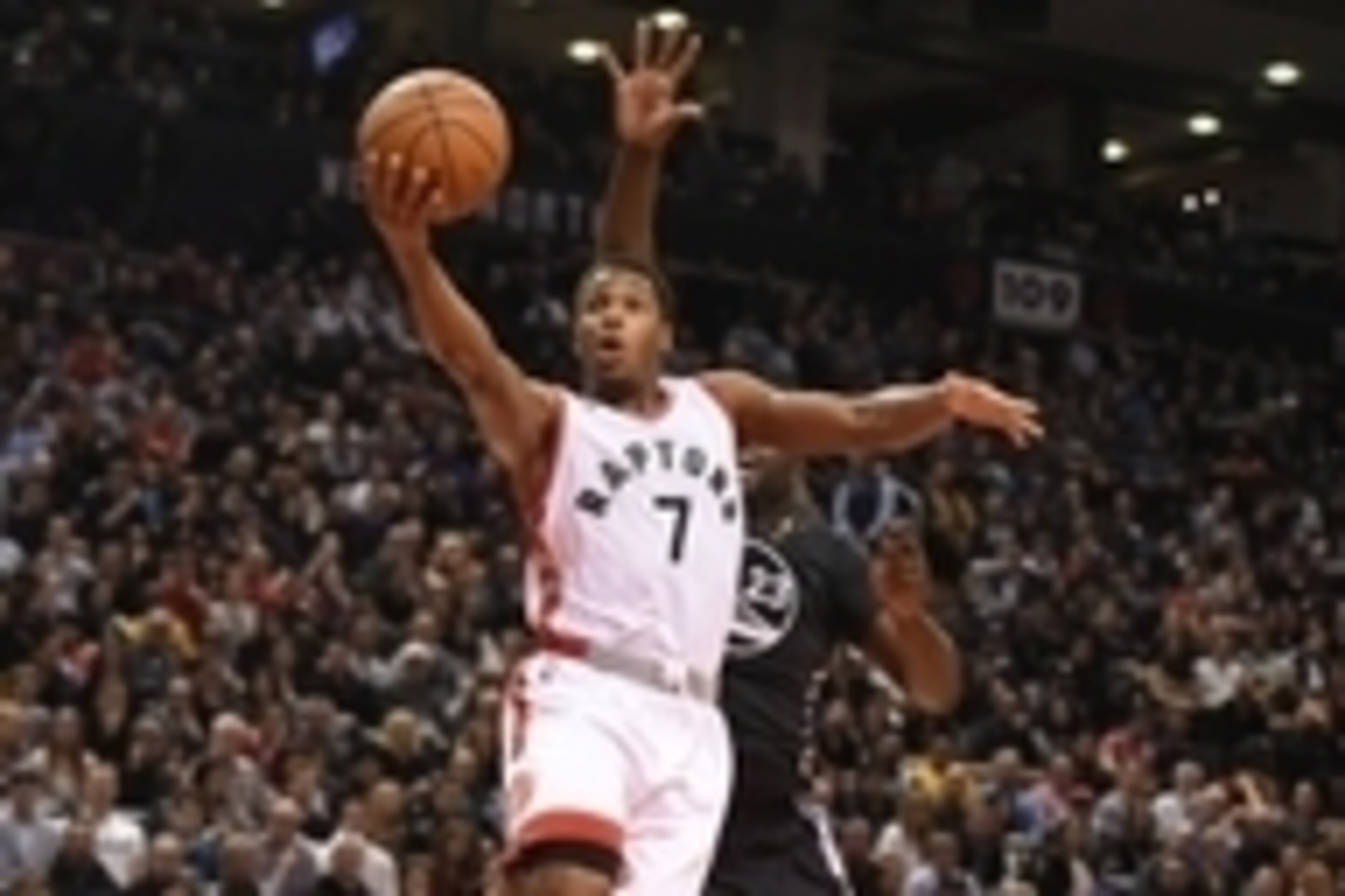Dec 5, 2015; Toronto, Ontario, CAN;   Toronto Raptors guard Kyle Lowry (7) makes a layup against Golden State Warriors forward Draymond Green (23) in the fourth quarter at Air Canada Centre. Mandatory Credit: Dan Hamilton-USA TODAY Sports