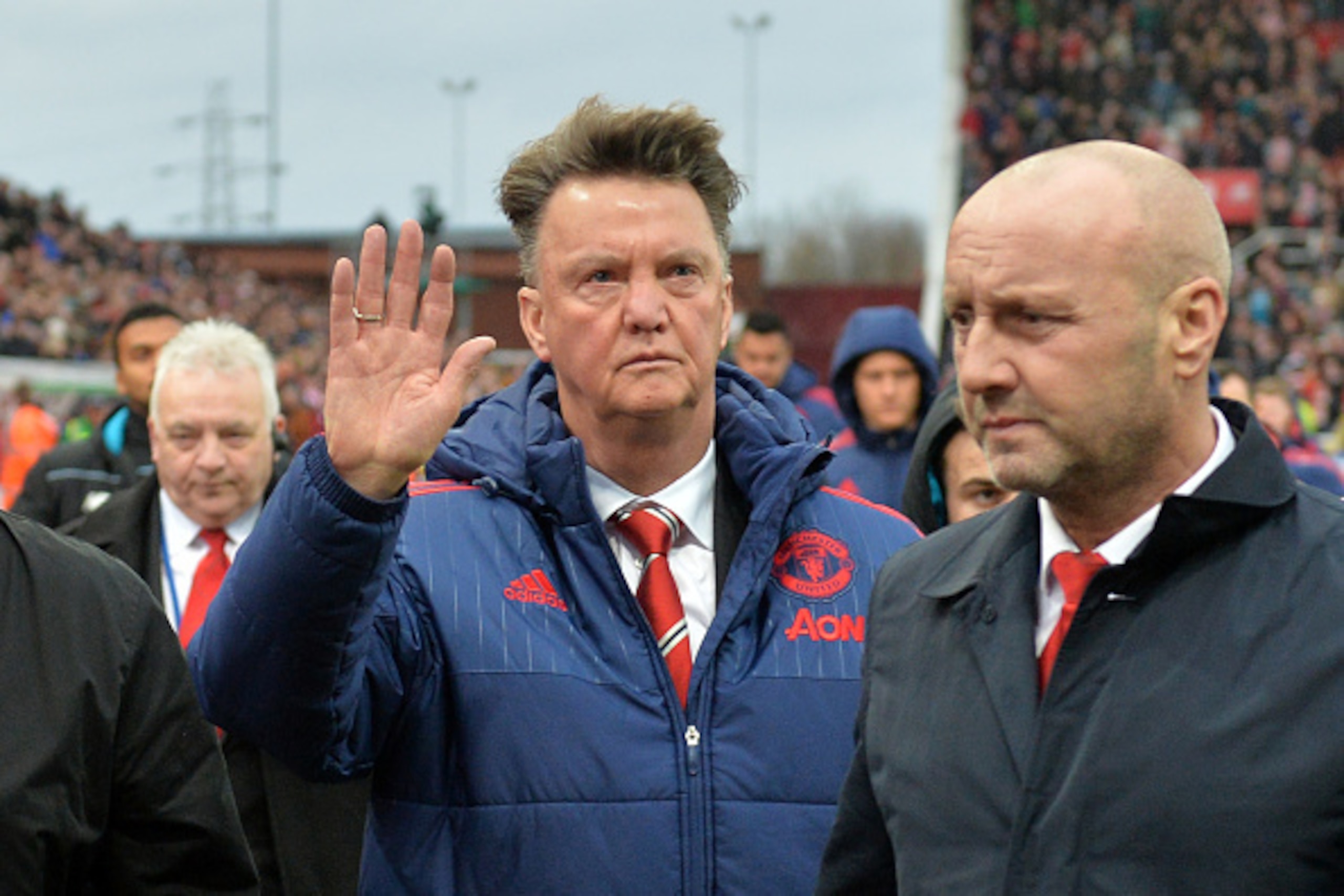 Manchester United's Dutch manager Louis van Gaal (C) waves as he leaves after the English Premier League football match between Stoke City and Manchester United at the Britannia Stadium in Stoke-on-Trent, central England on December 26, 2015. Stoke won th