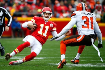 KANSAS CITY, MO - DECEMBER 27:  Alex Smith #11 of the Kansas City Chiefs slides after a rush at Arrowhead Stadium during the first quarter of the game on December 27, 2015 in Kansas City, Missouri. (Photo by Jamie Squire/Getty Images)