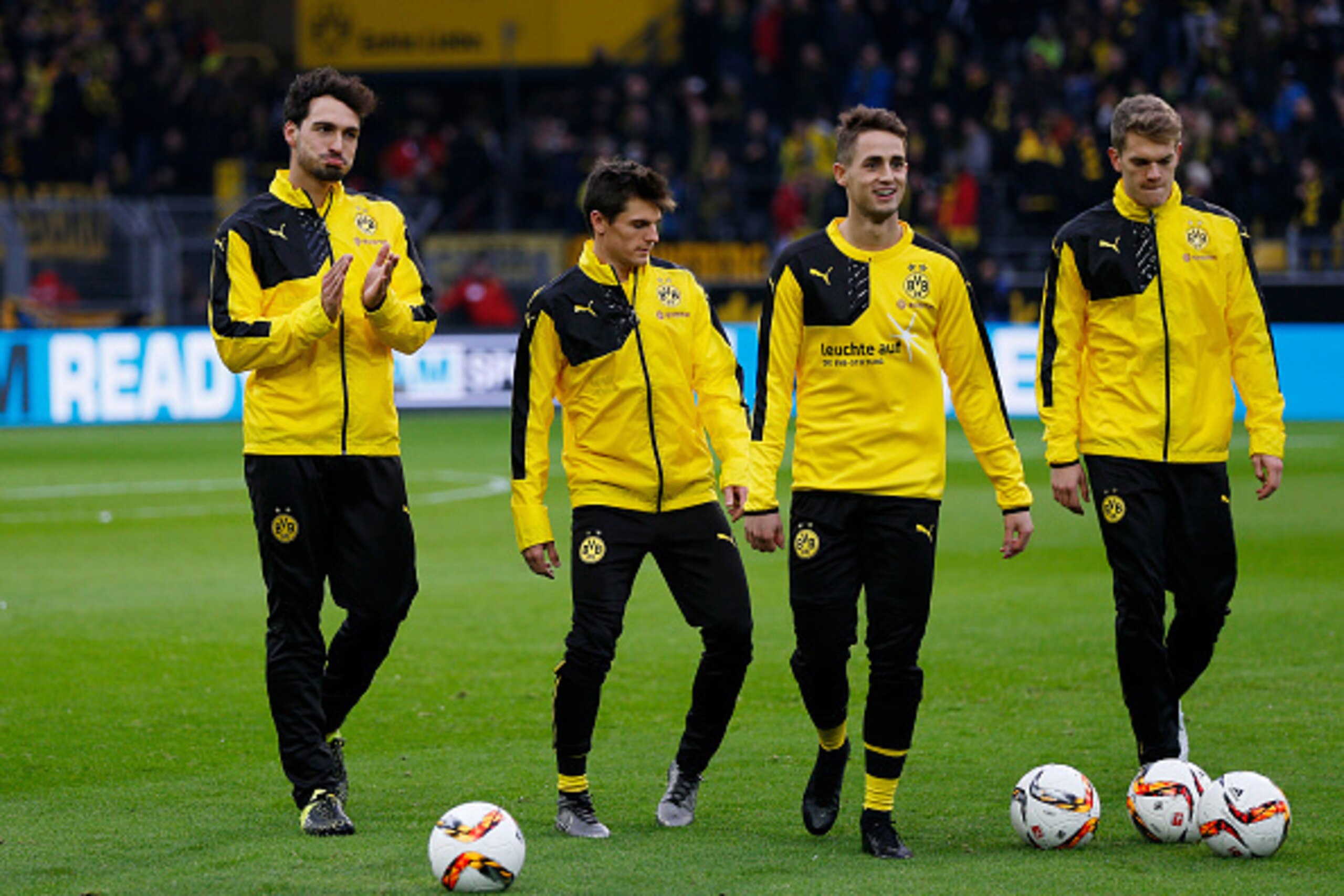 (From L) Dortmund's defender Mats Hummels, midfielder Jonas Hofmann, Belgian midfielder Adnan Januzaj and defender Matthias Ginter warm up prior to the German first division Bundesliga football match Borussia Dortmund vs VfB Stuttgart, in Dortmund, wester
