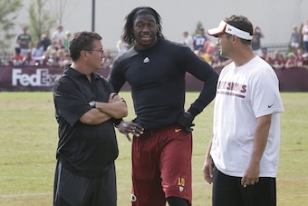 Gruden convinced RG3's biggest fan, owner Dan Snyder (L), his team would be better with a different QB.