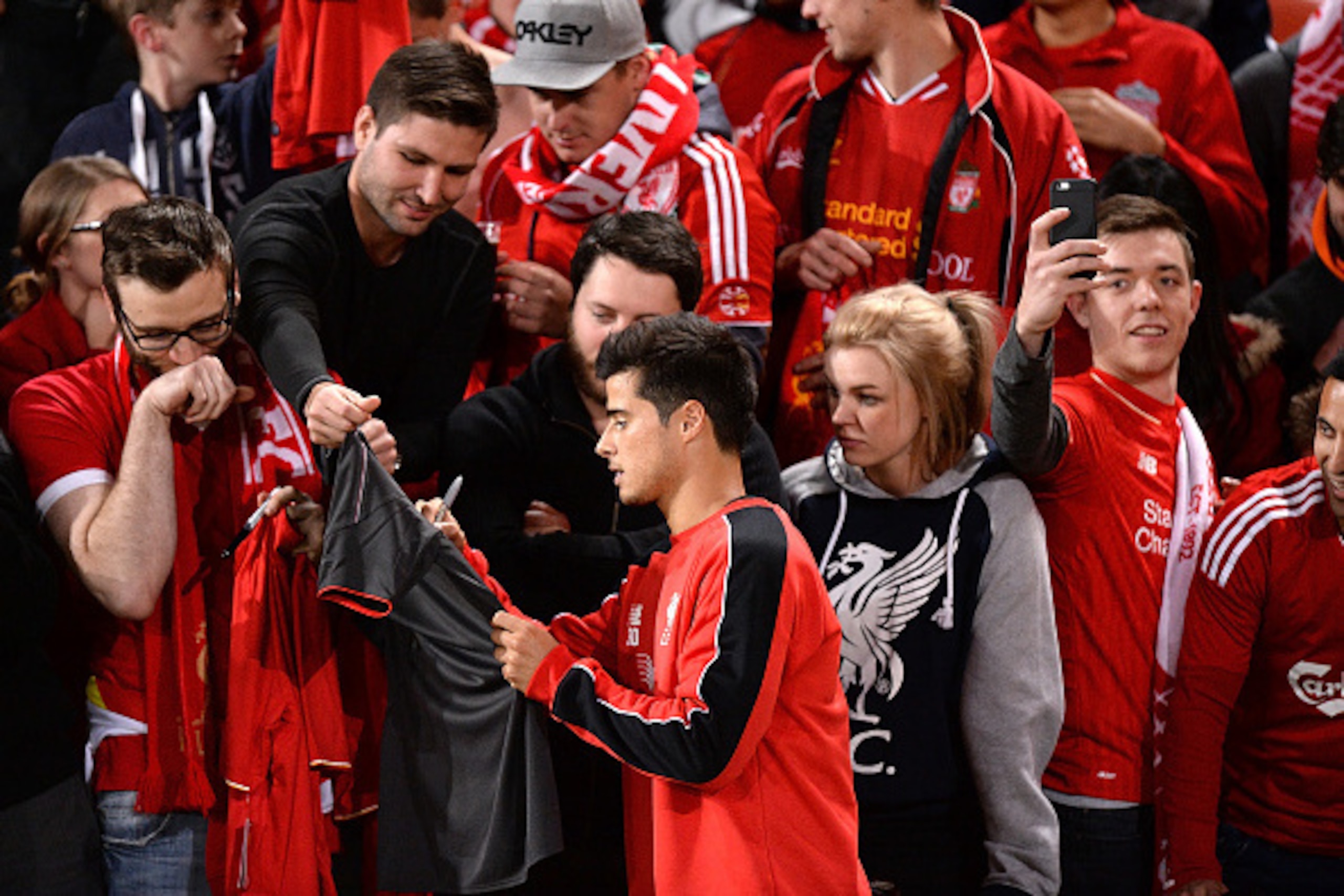 BRISBANE, AUSTRALIA - JULY 16: Joao Carlos Teixeira signs autographs for fans during a Liverpool FC training session at Suncorp Stadium on July 16, 2015 in Brisbane, Australia.  (Photo by Bradley Kanaris/Getty Images)