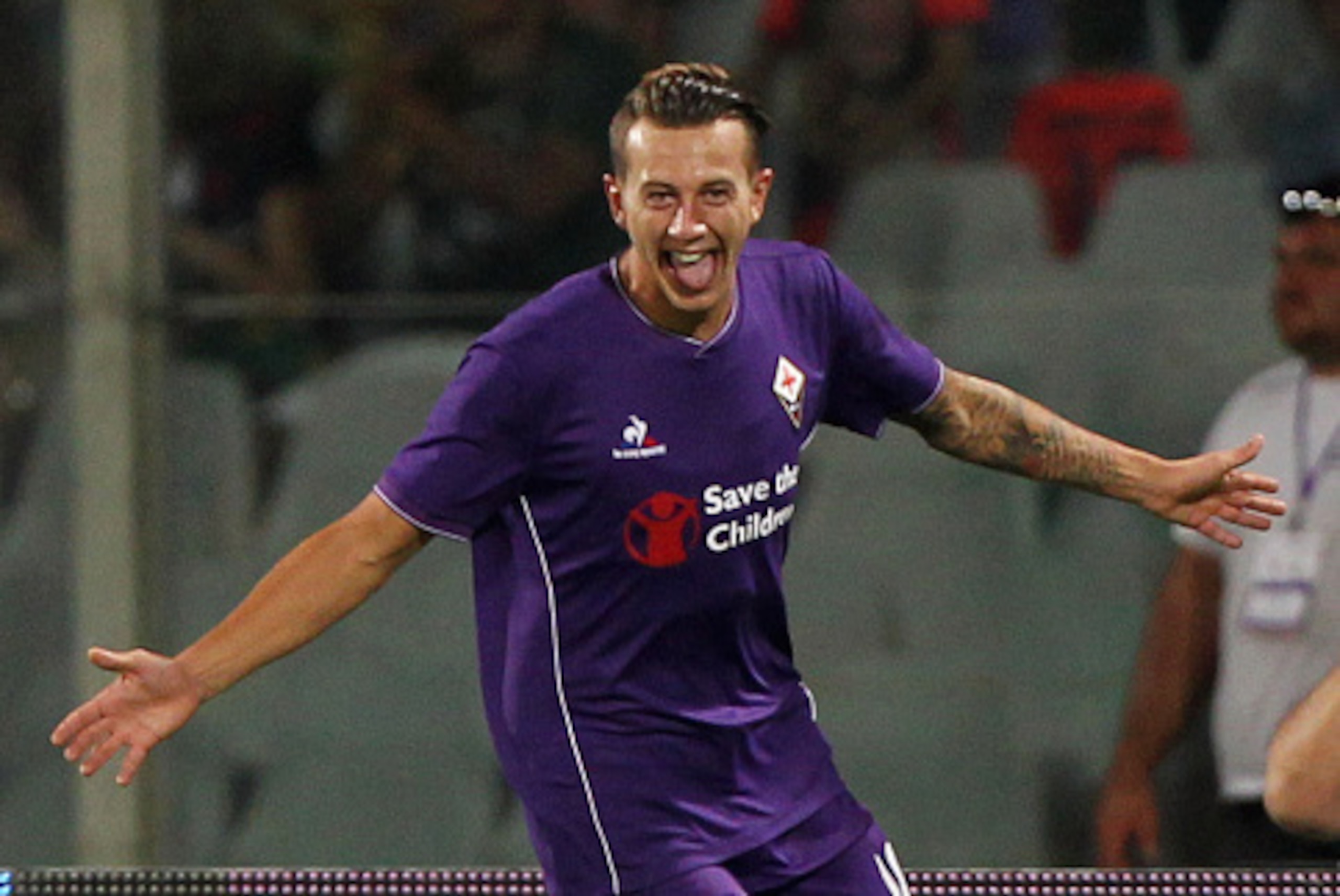 FLORENCE, ITALY - AUGUST 02:  Federico Bernardeschi of ACF Fiorentina celebrates after scoring the opening goal during the preseason friendly match between ACF Fiorentina and FC Barcelona at Artemio Franchi on August 2, 2015 in Florence, Italy.  (Photo by