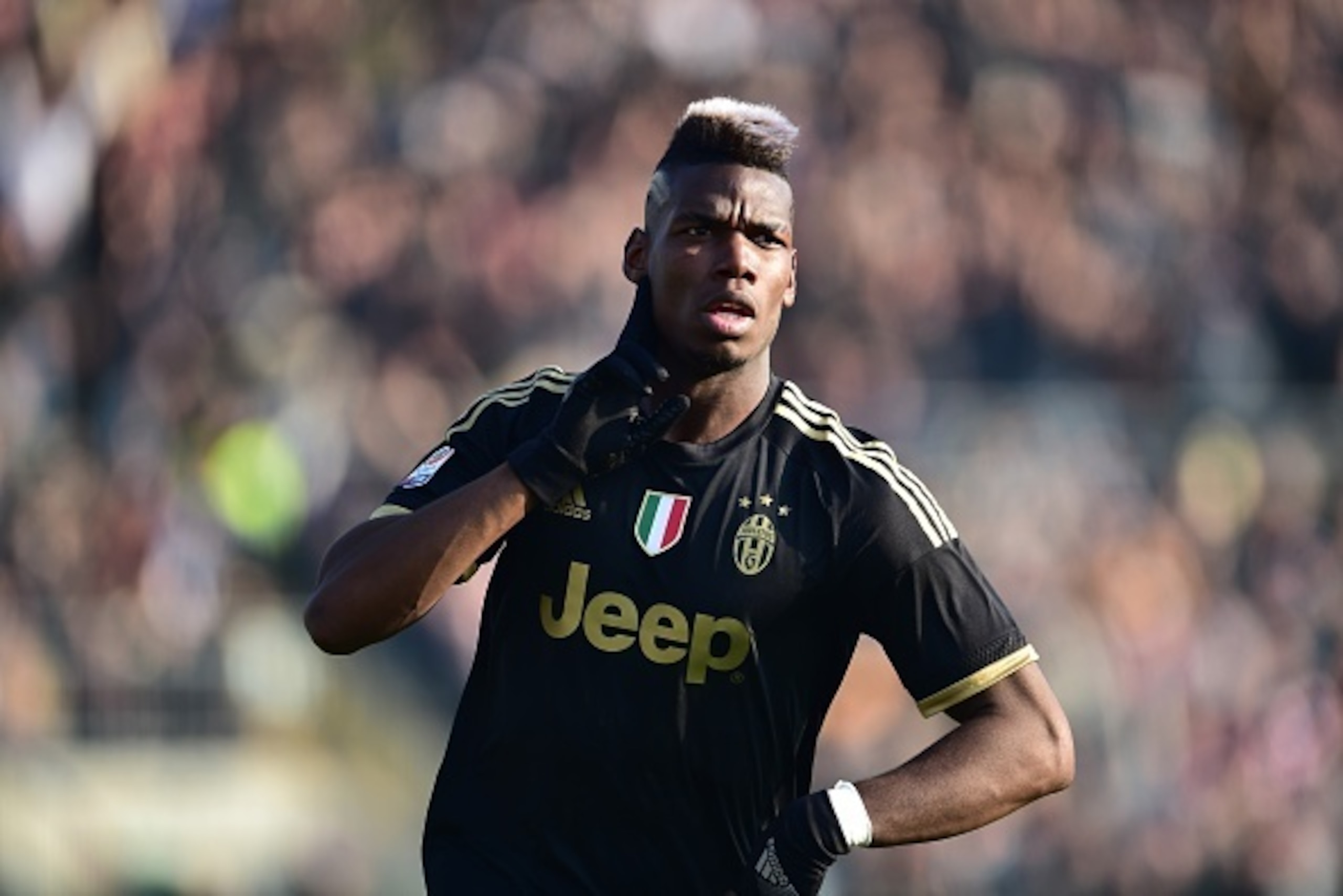 Juventus' midfielder from France Paul Pogba celebrates after scoring during the Italian Serie A football match between Carpi and Juventus at Alberto Braglia Stadium in Modena on December 20, 2015. AFP PHOTO / GIUSEPPE CACACE / AFP / GIUSEPPE CACACE       