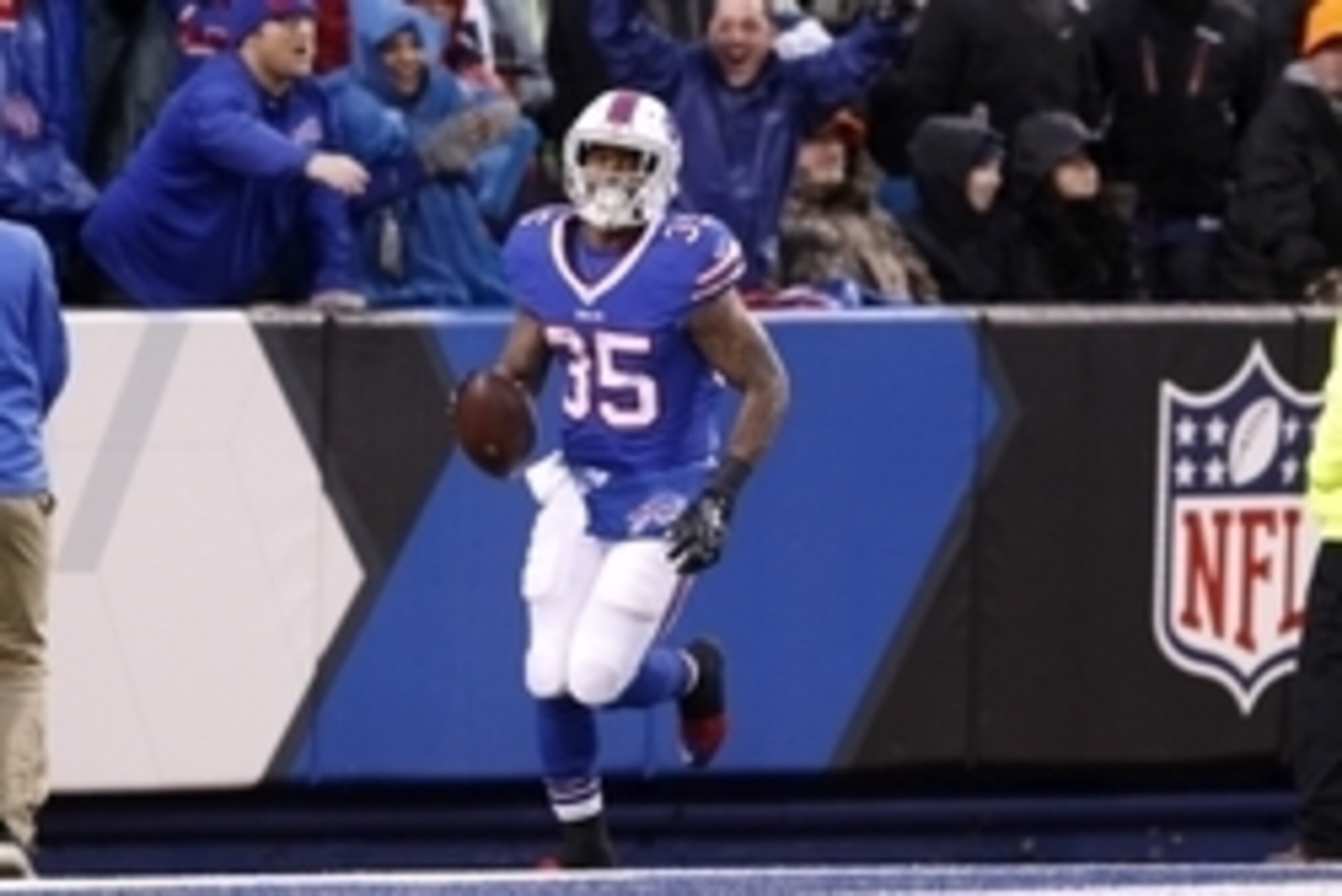 Dec 27, 2015; Orchard Park, NY, USA; Buffalo Bills running back Mike Gillislee (35) runs the ball in for a touchdown during the second half against the Dallas Cowboys at Ralph Wilson Stadium. Buffalo defeat Dallas 16-6.  Mandatory Credit: Timothy T. Ludwi