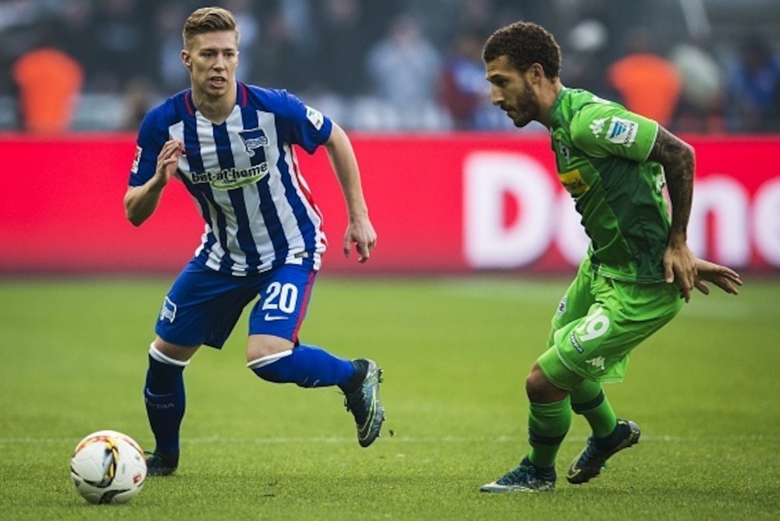 Hertha's midfielder Mitchell Weiser and Moenchengladbach's US defender Fabian Johnson vie for the ball during the German first division Bundesliga football match Hertha BSC Berlin vs Borussia Moenchengladbach at the Olympic Stadium in Berlin, on October 3