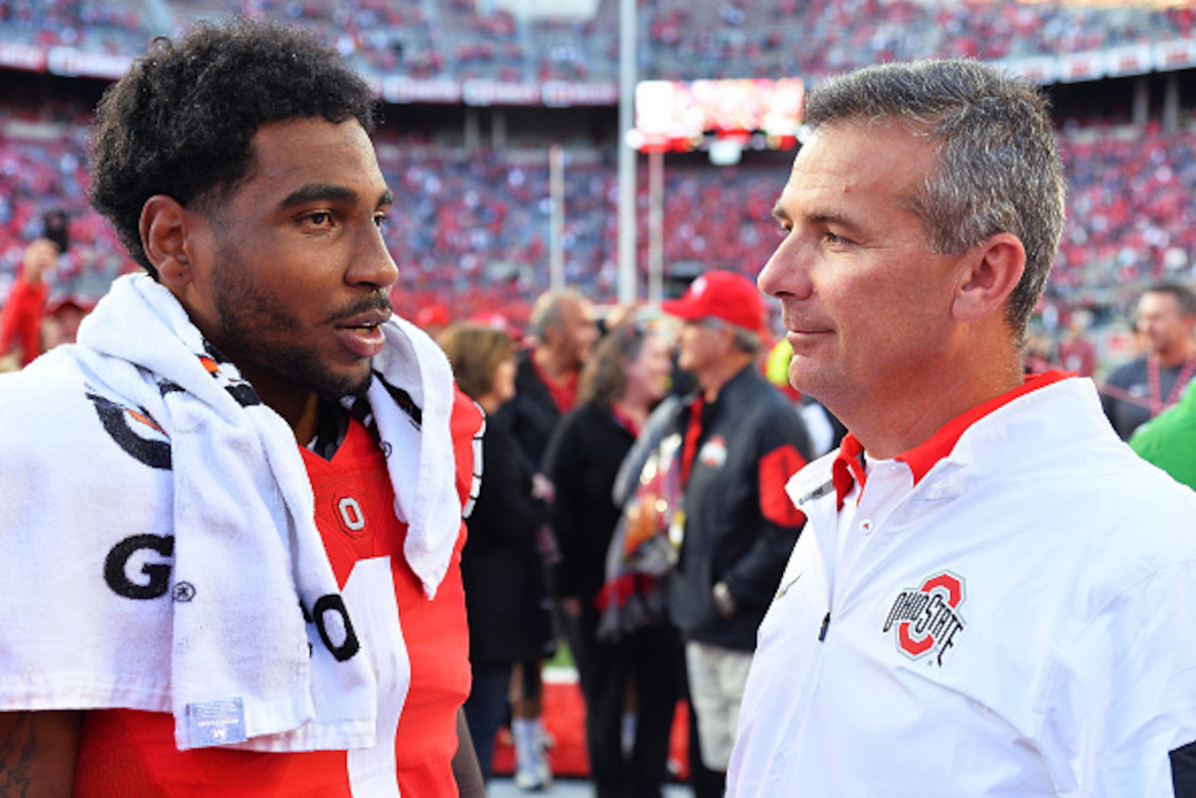 COLUMBUS, OH - SEPTEMBER 12:  Braxton Miller #1 of the Ohio State Buckeyes talks with Head Coach Urban Meyer of the Ohio State Buckeyes after their game against the Hawaii Rainbow Warriors at Ohio Stadium on September 12, 2015 in Columbus, Ohio. Ohio Stat