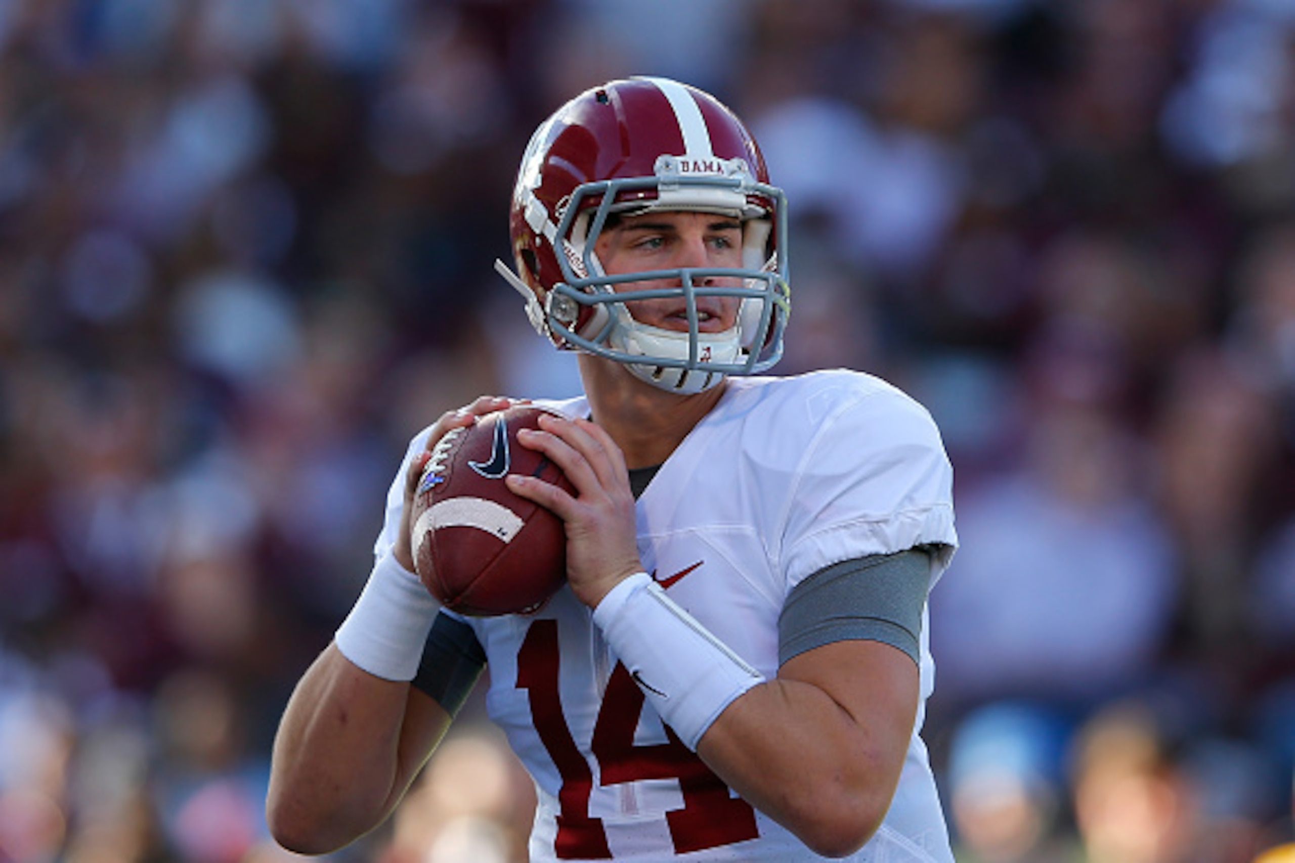STARKVILLE, MS - NOVEMBER 14:  Jake Coker #14 of the Alabama Crimson Tide looks to pass against the Mississippi State Bulldogs at Davis Wade Stadium on November 14, 2015 in Starkville, Mississippi.  (Photo by Kevin C. Cox/Getty Images)
