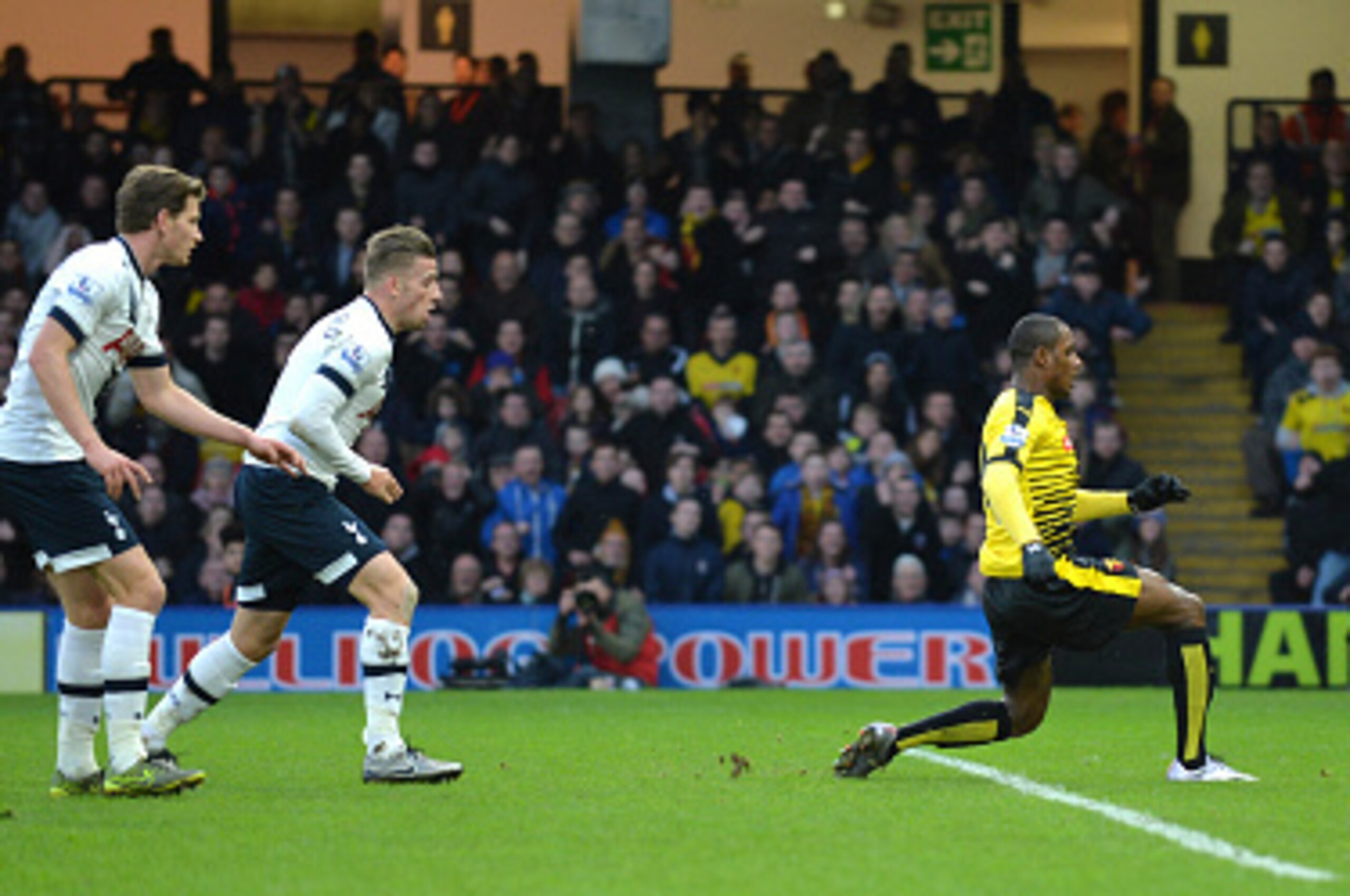 Tottenham Hotspur's Belgian defenders Jan Vertonghen and Toby Alderweireld (2nd L) look on as Watford's Nigerian striker Odion Ighalo (2nd R) shoots past Tottenham Hotspur's French goalkeeper Hugo Lloris (R) to score their first goal during the English Pr
