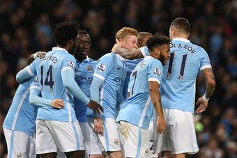 MANCHESTER, ENGLAND - DECEMBER 26:  Kevin De Bruyne of Manchester City is congratulated by teammates after scoring his team's fourth goal during the Barclays Premier League match between Manchester City and Sunderland at the Etihad Stadium on December 26,