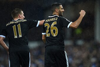 Leicester City's Algerian midfielder Riyad Mahrez (R) celebrates after scoring his and Leicester's second goal from the penalty spot during the English Premier League football match between Everton and Leicester City at Goodison Park in Liverpool, north w