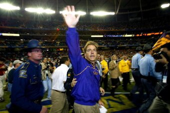 ATLANTA - DECEMBER 6:  Head coach Nick Saban of the LSU Tigers waves to the fans after LSU defeated the Georgia Bulldogs 34-13 to win the SEC Championship Game on December 6, 2003 at the Georgia Dome in Atlanta, Georgia.  (Photo by Jamie Squire/Getty Imag